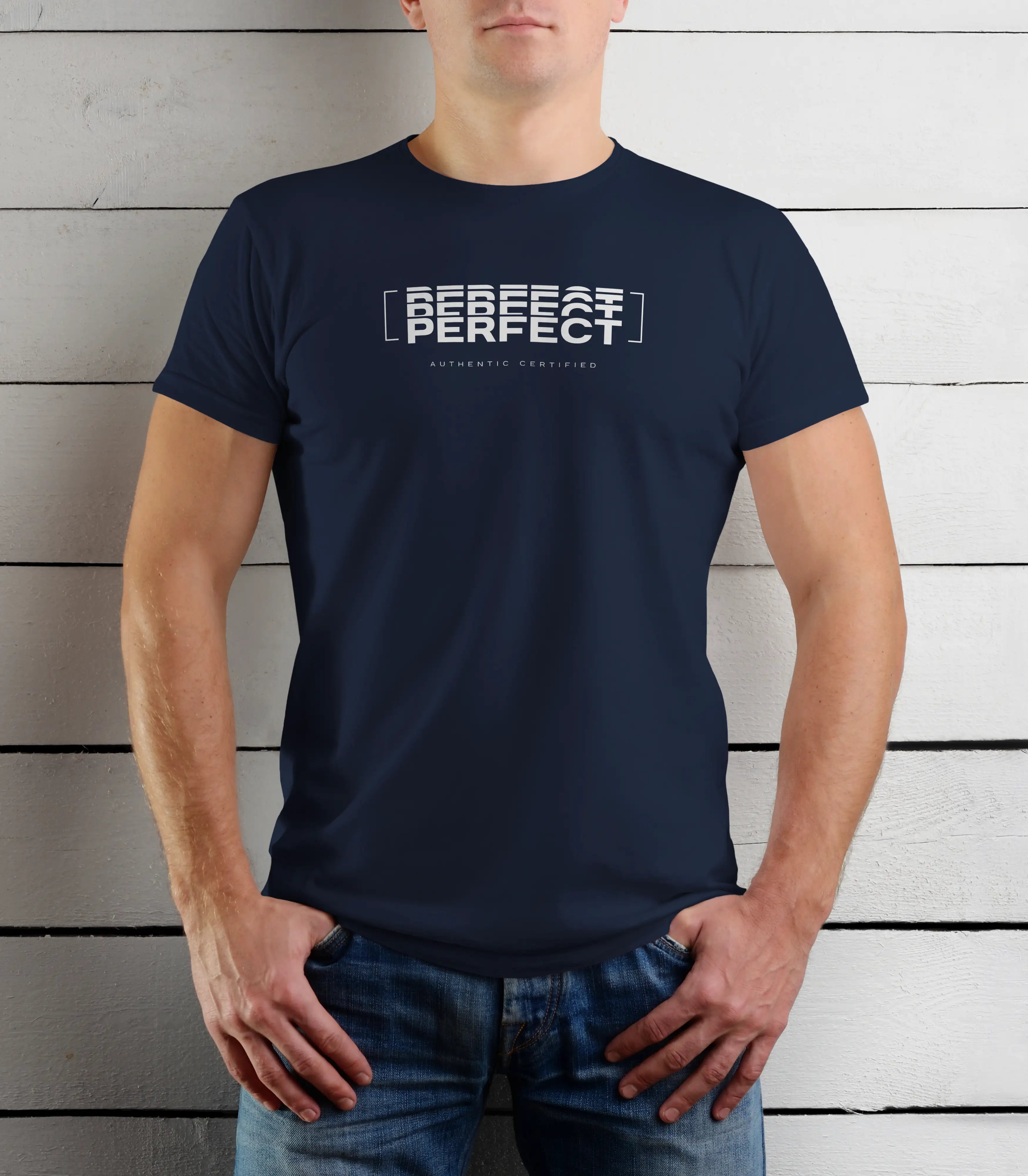 Person wearing a navy blue t-shirt with text against a wooden background