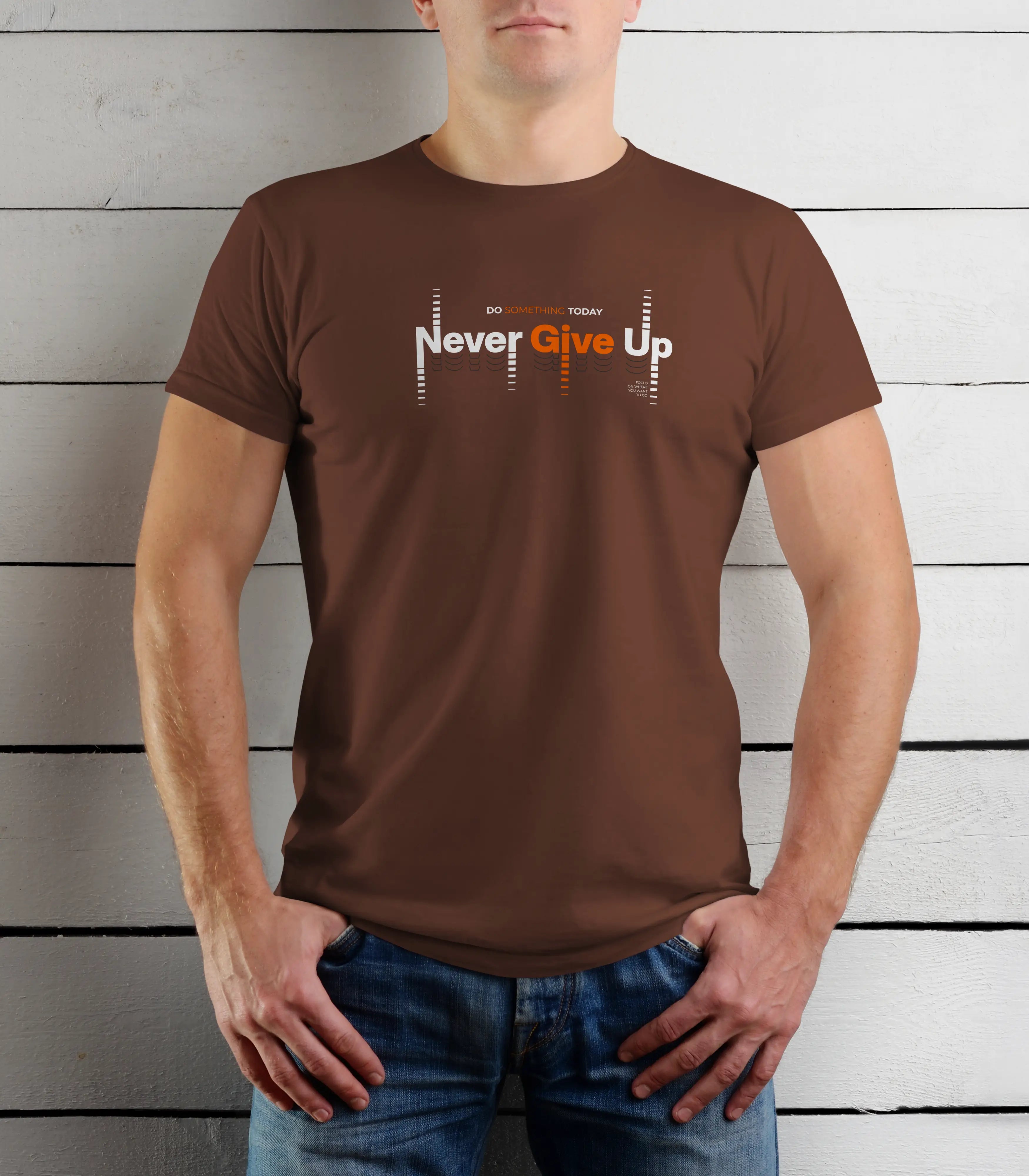 Person wearing a brown t-shirt with 'Never Give Up' text against a wooden background