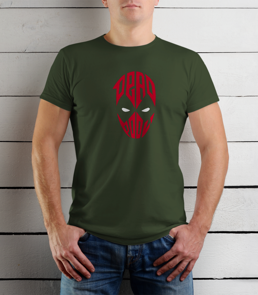 Person wearing a green t-shirt with a red graphic design on a wooden background