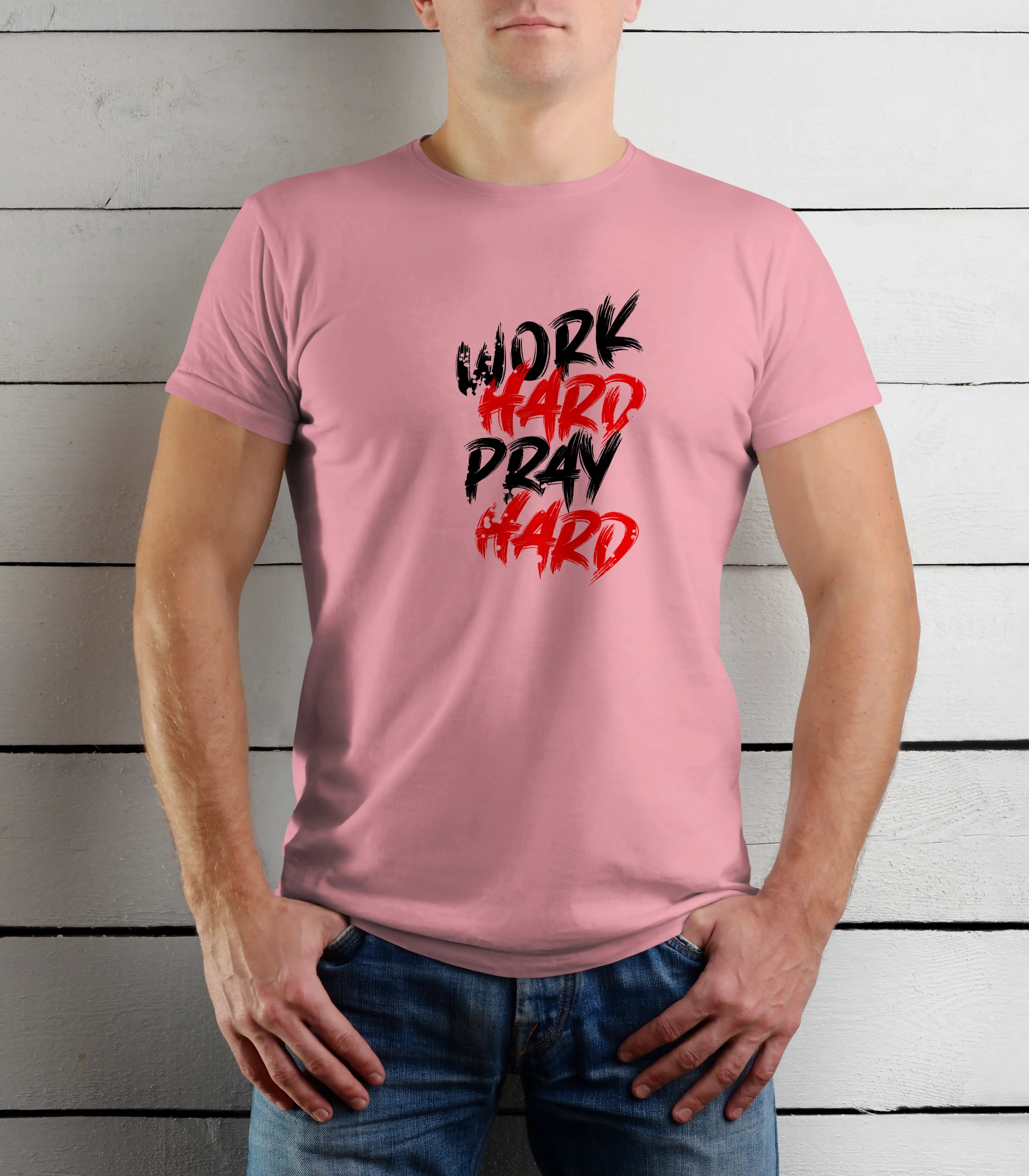 Person wearing a pink t-shirt with 'Work Hard Pray Hard' text against a wooden background