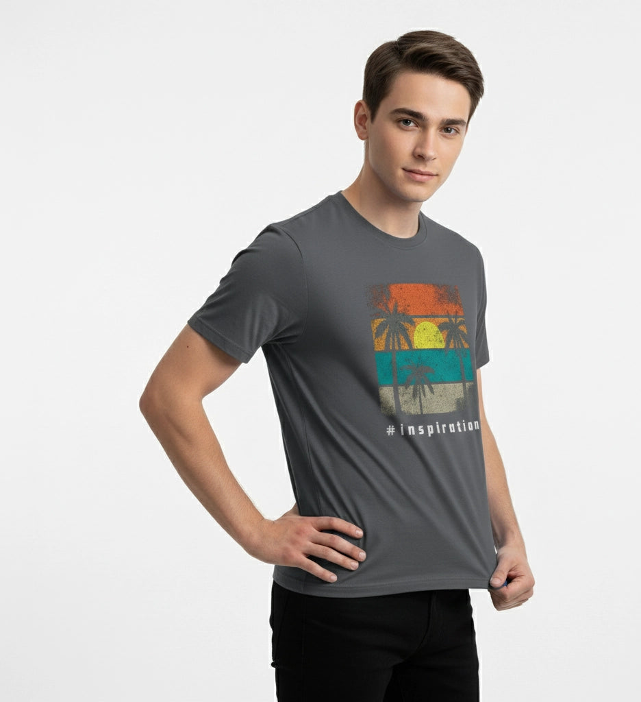 Man wearing a gray t-shirt with a colorful graphic design on a white background