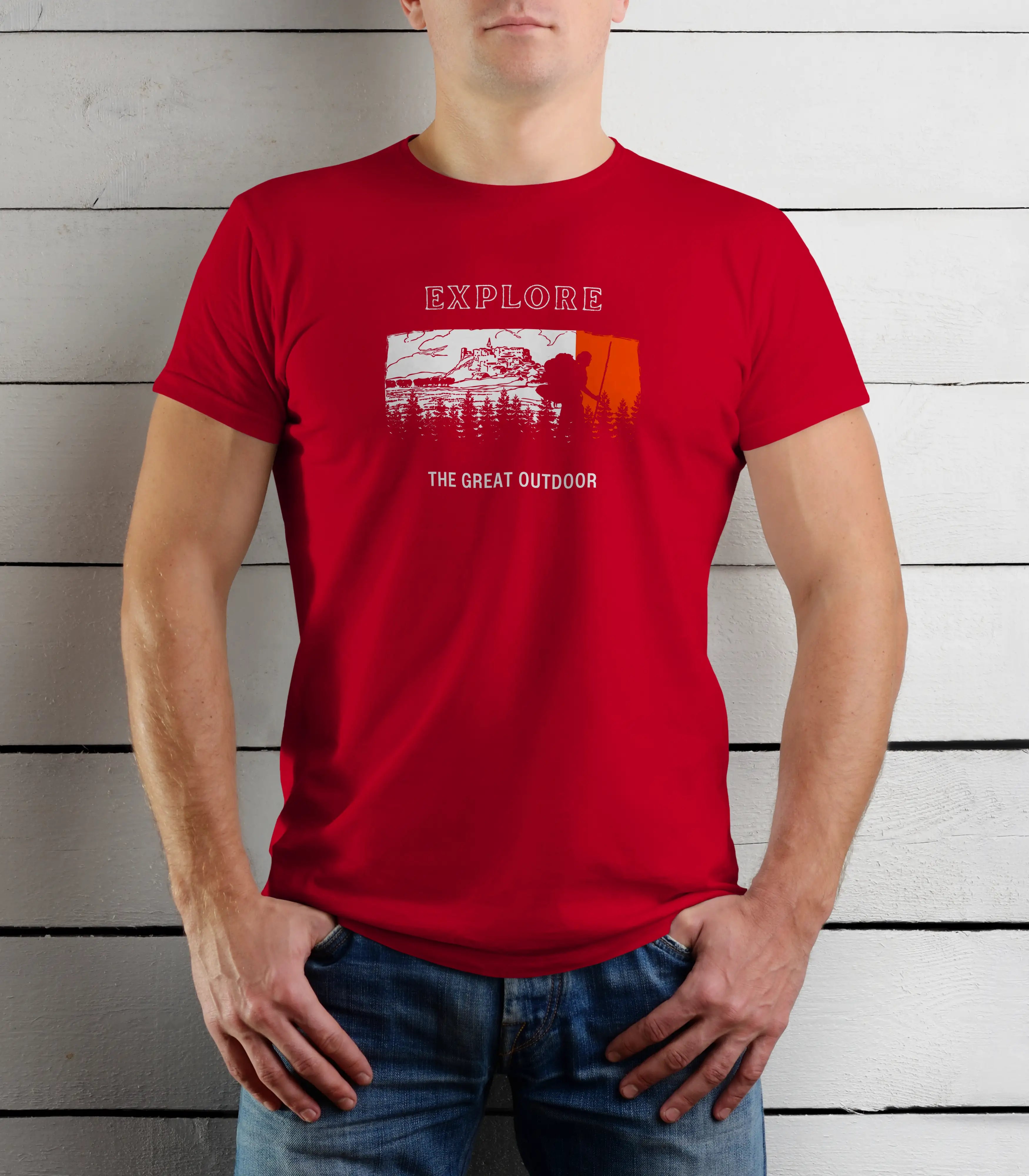 Person wearing a red t-shirt with 'Explore The Great Outdoor' graphic against a wooden background