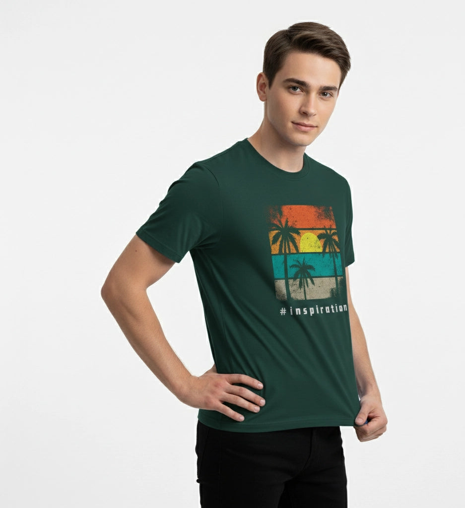 Man wearing a green t-shirt with a tropical design on a white background