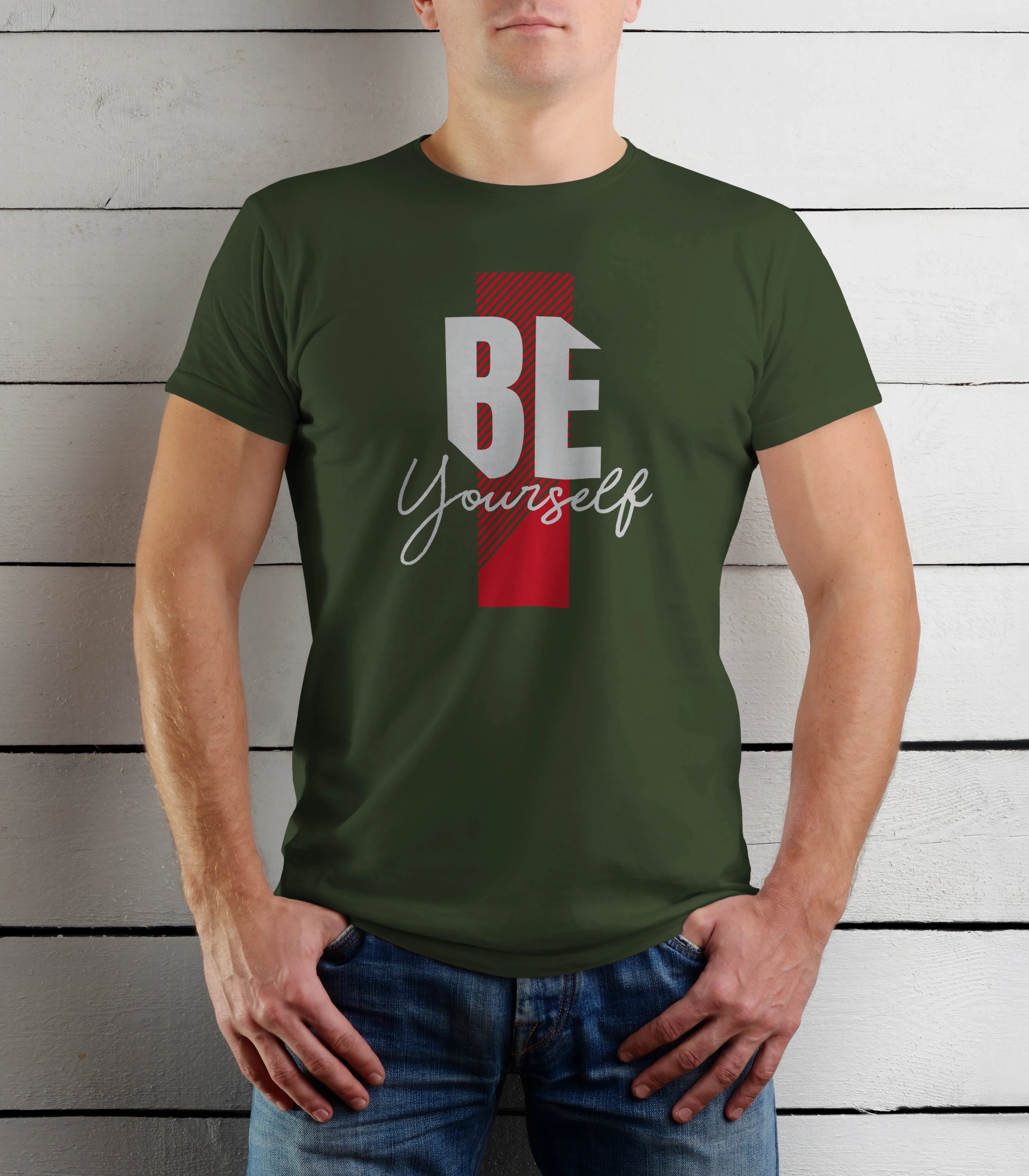 Person wearing a green t-shirt with 'BE Yourself' text on a wooden background