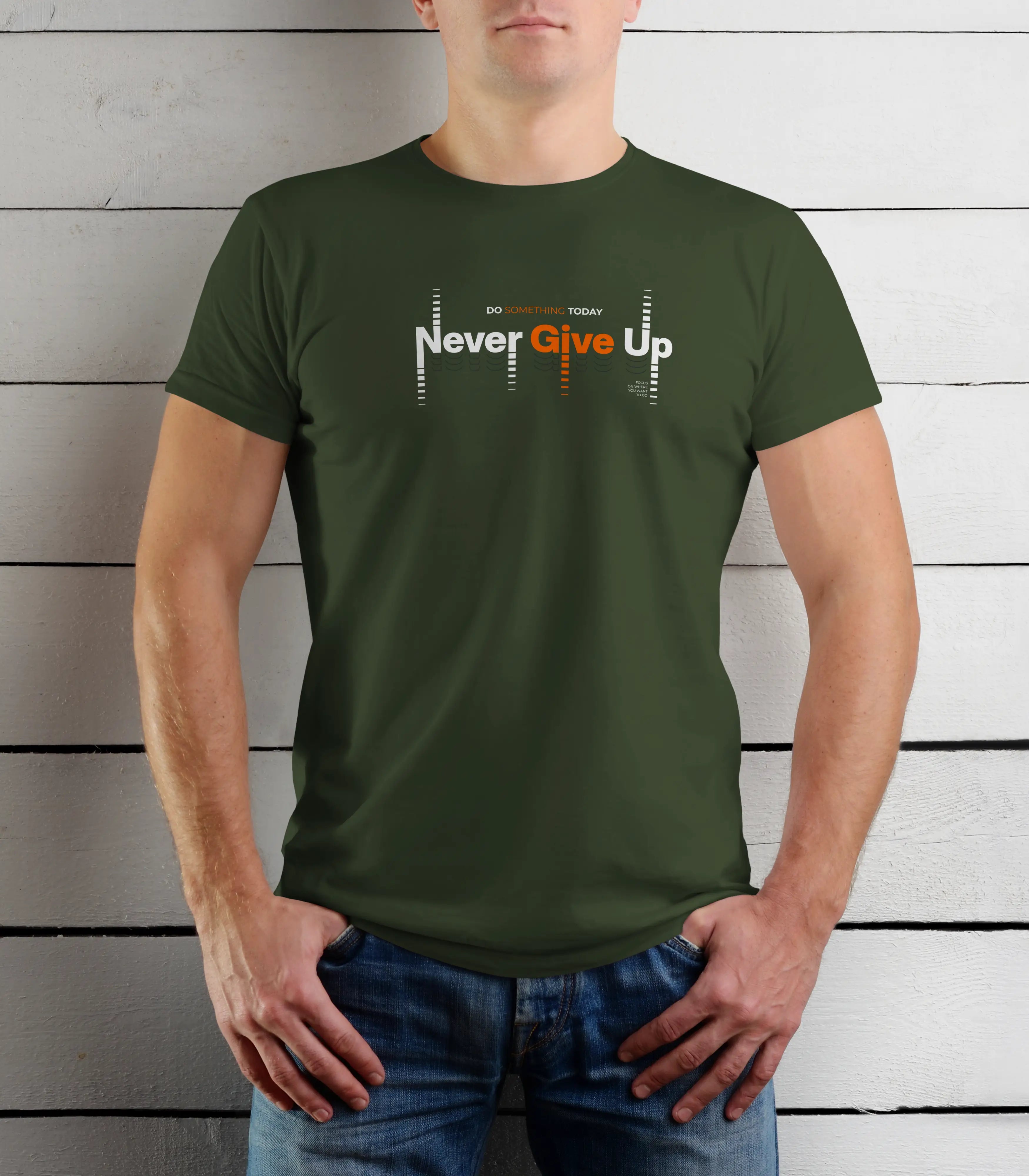 Person wearing a green t-shirt with 'Never Give Up' text against a wooden background