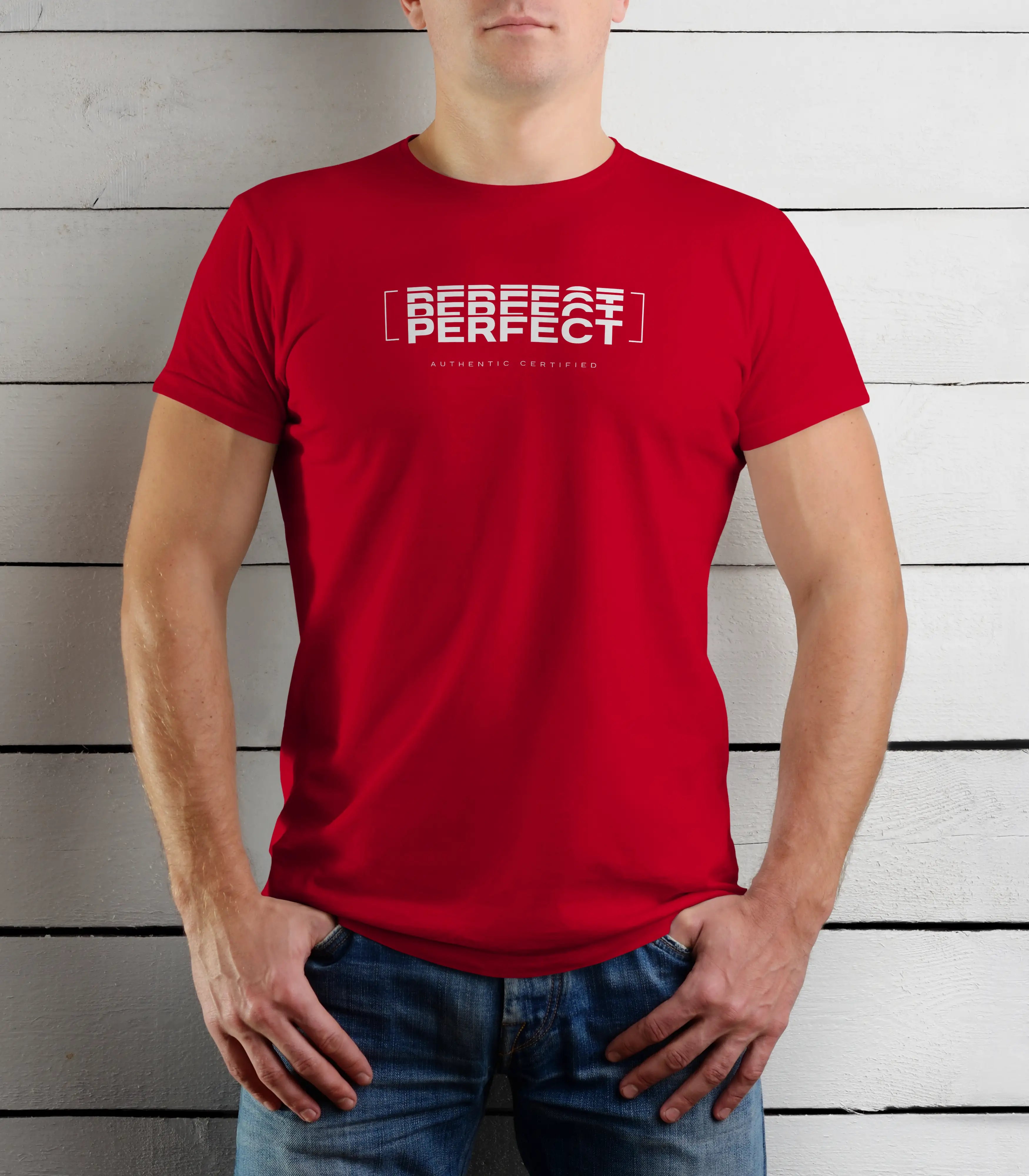Person wearing a red t-shirt with text against a wooden background