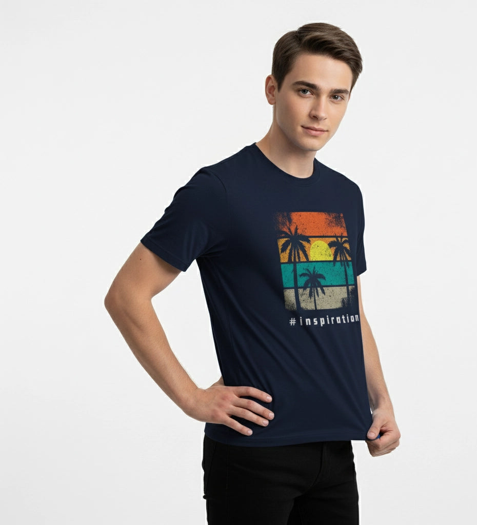 Man wearing a navy blue t-shirt with a colorful graphic design on a white background