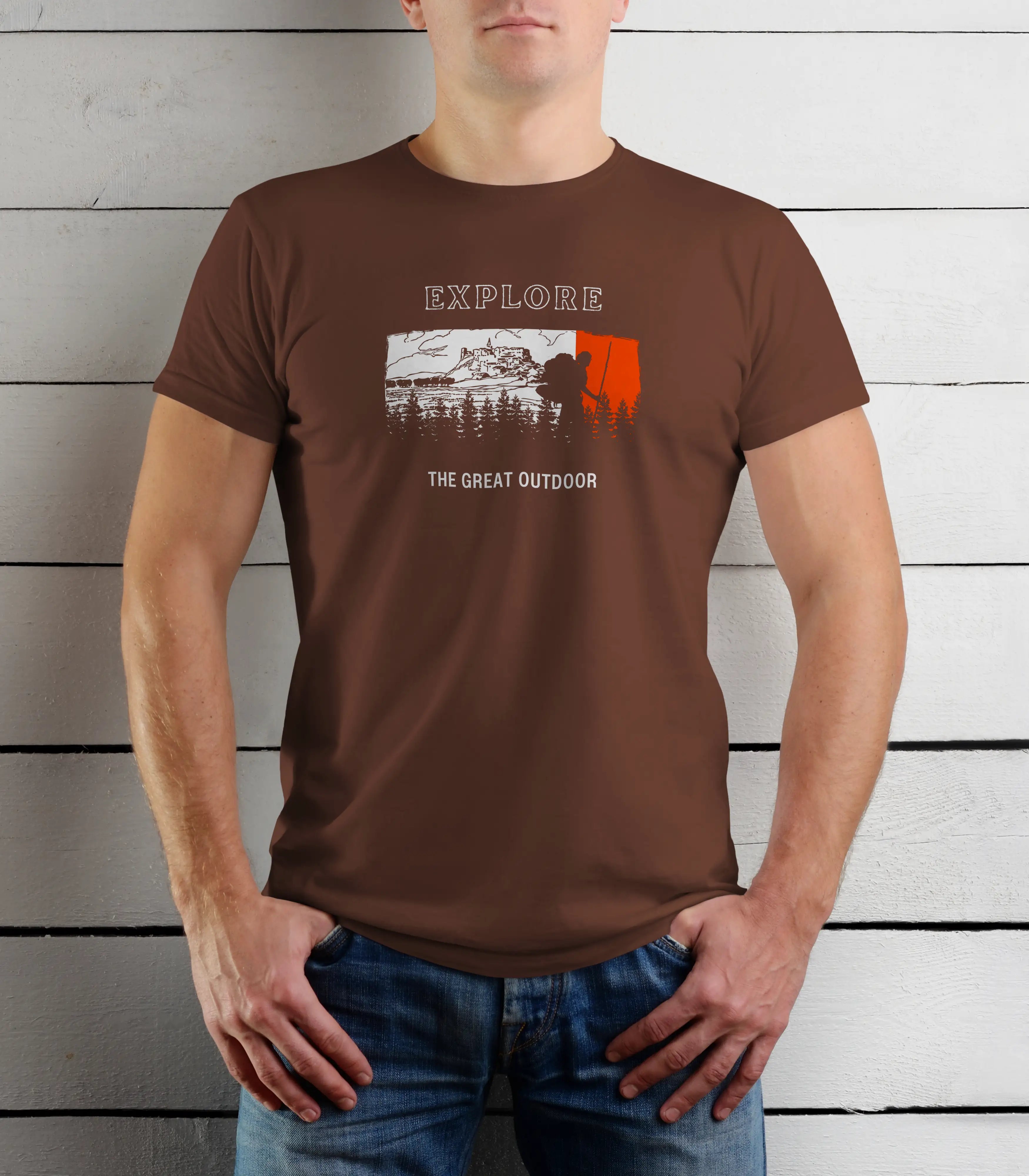 Person wearing a brown t-shirt with 'Explore The Great Outdoors' graphic design.
