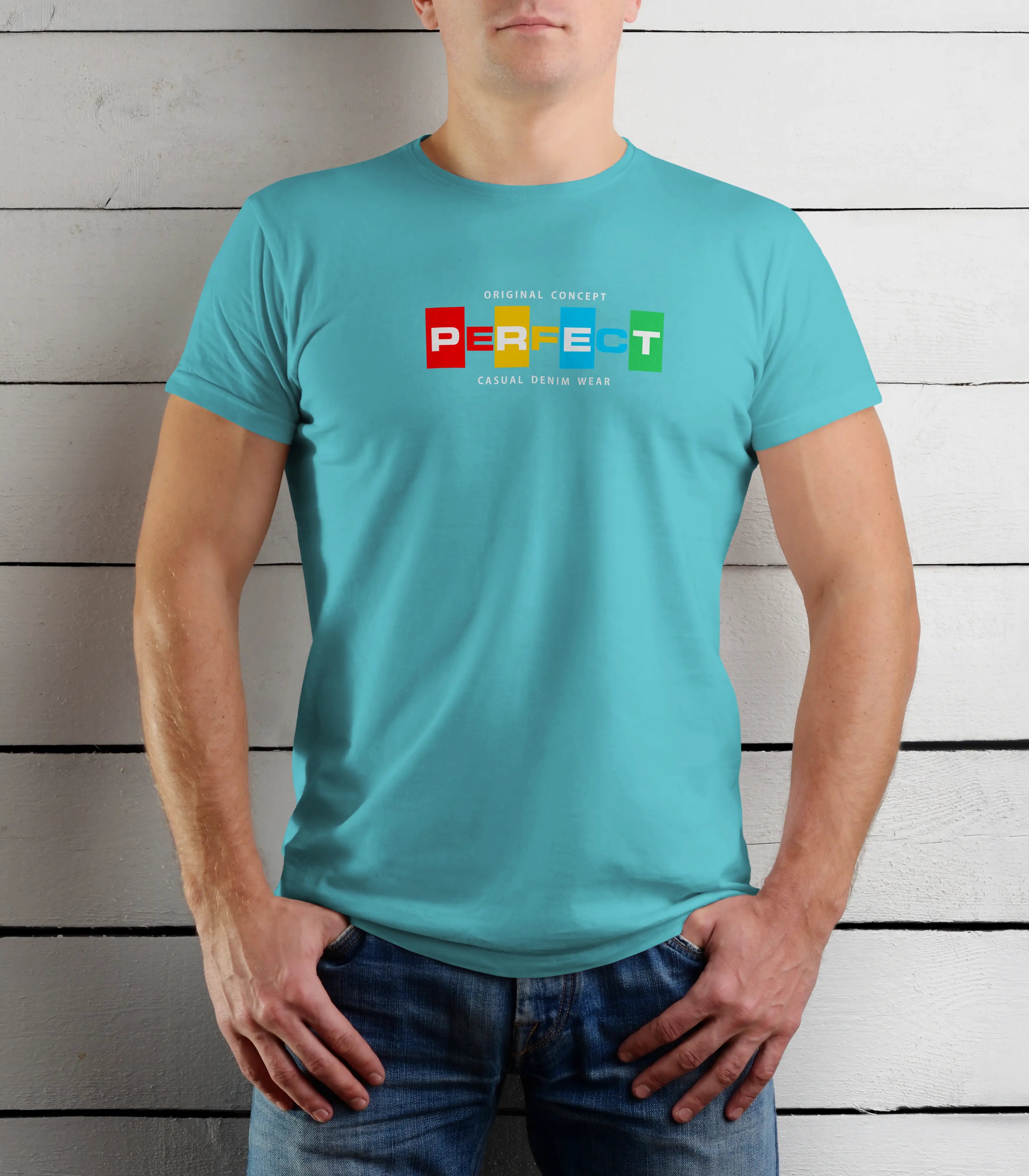 Person wearing a turquoise t-shirt with colorful text design against a wooden background