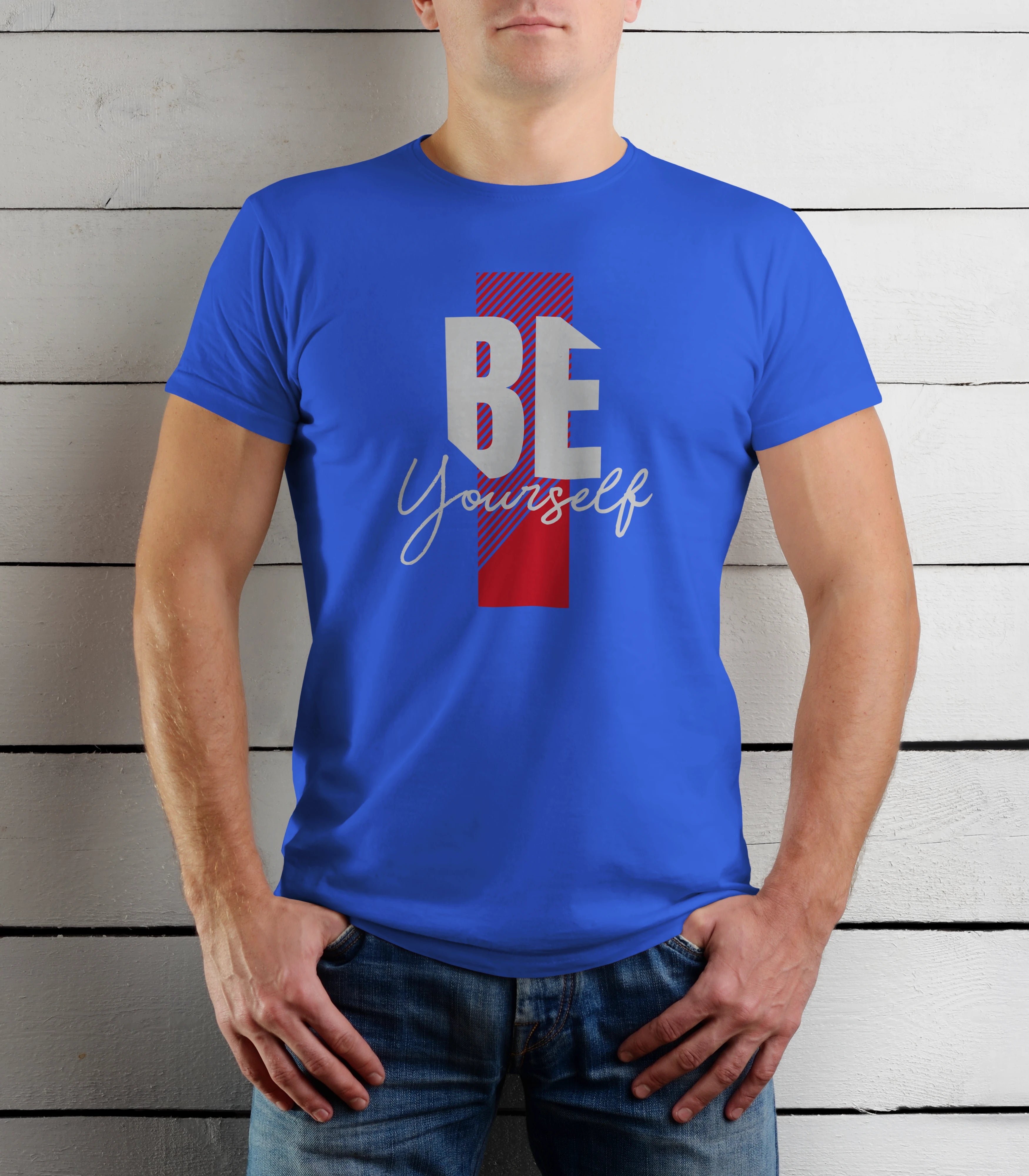 Person wearing a blue t-shirt with 'BE Yourself' text against a wooden background