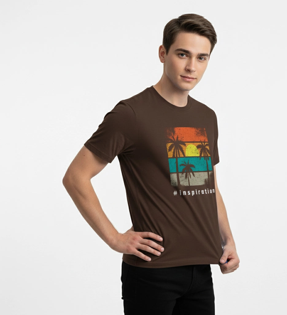 Man wearing a brown t-shirt with a colorful graphic design on a white background