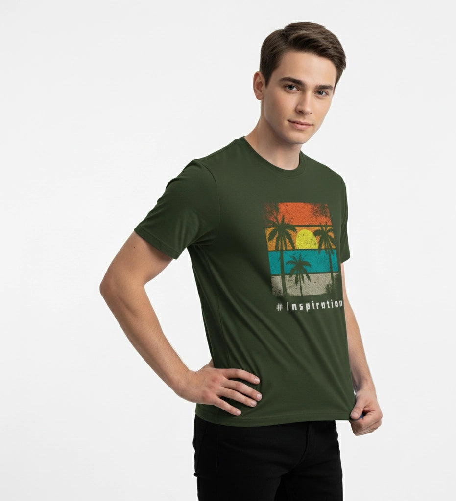Man wearing a green t-shirt with a tropical design on a white background