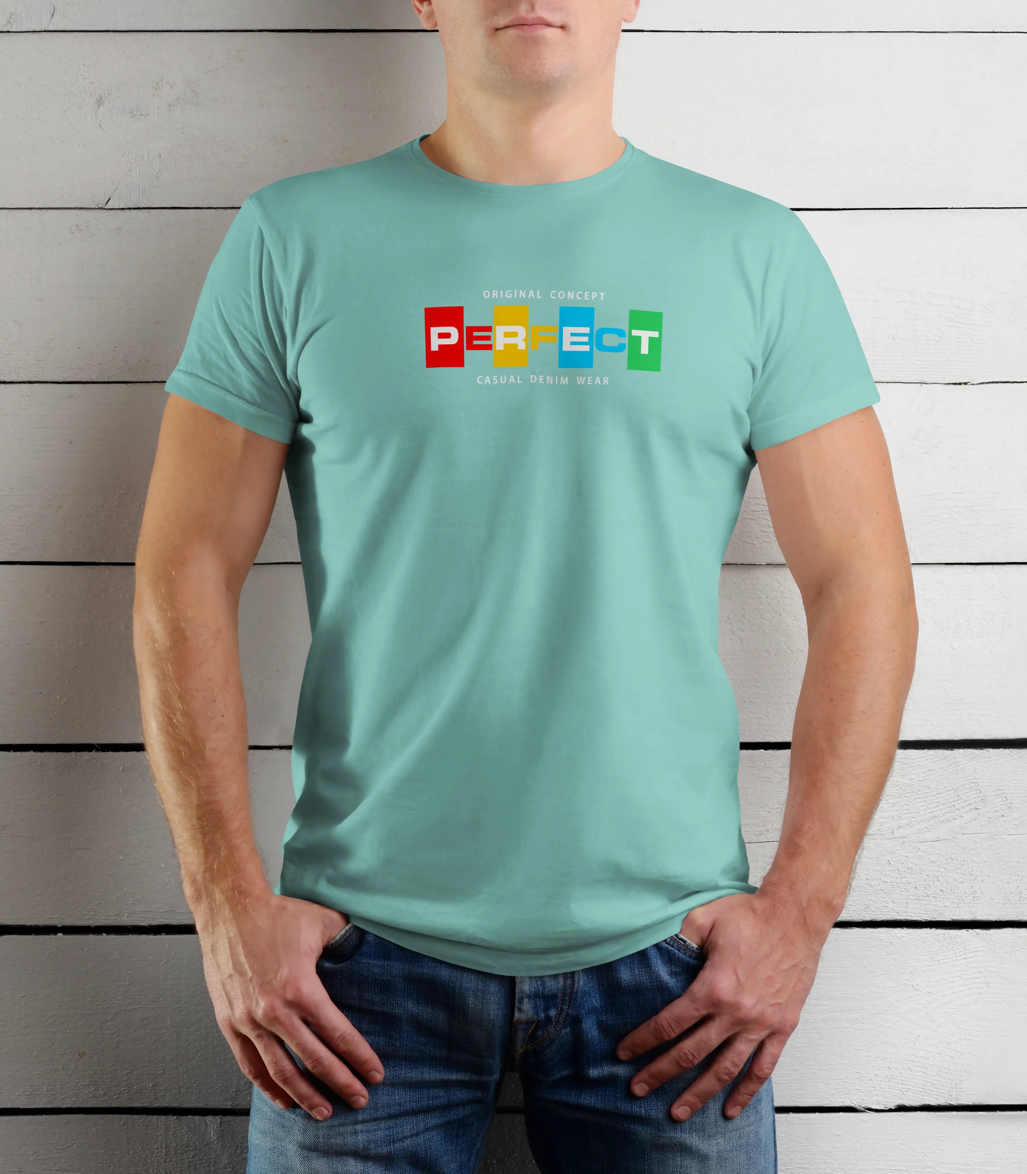 Person wearing a light blue t-shirt with colorful text design against a wooden background