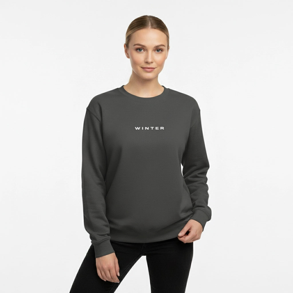 Woman wearing a dark gray sweatshirt with 'WINTER' text on a light gray background