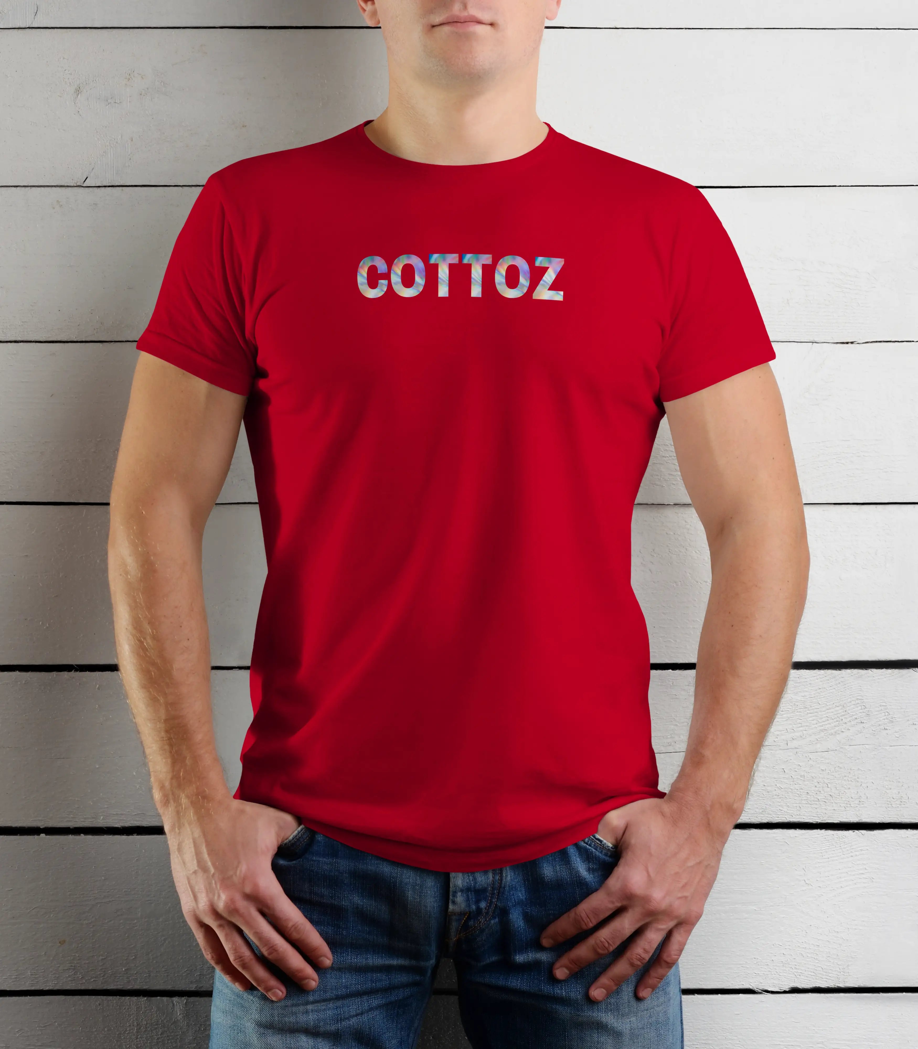 Person wearing a red t-shirt with 'COTTOZ' printed on it against a wooden background