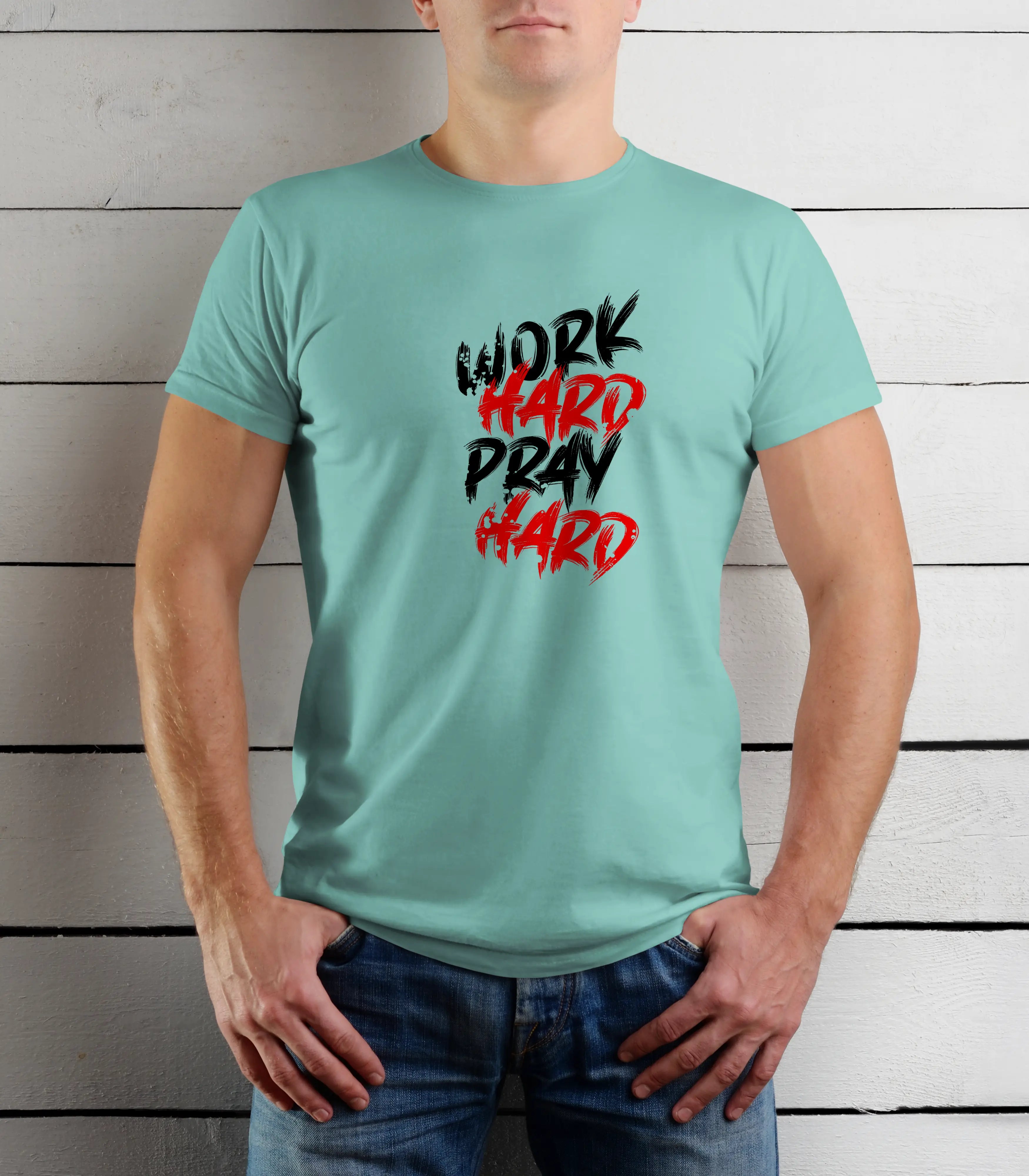 Person wearing a light blue t-shirt with 'Work Hard Pray Hard' text against a wooden background