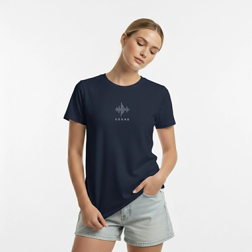 Woman wearing a navy blue t-shirt with a graphic design on a white background