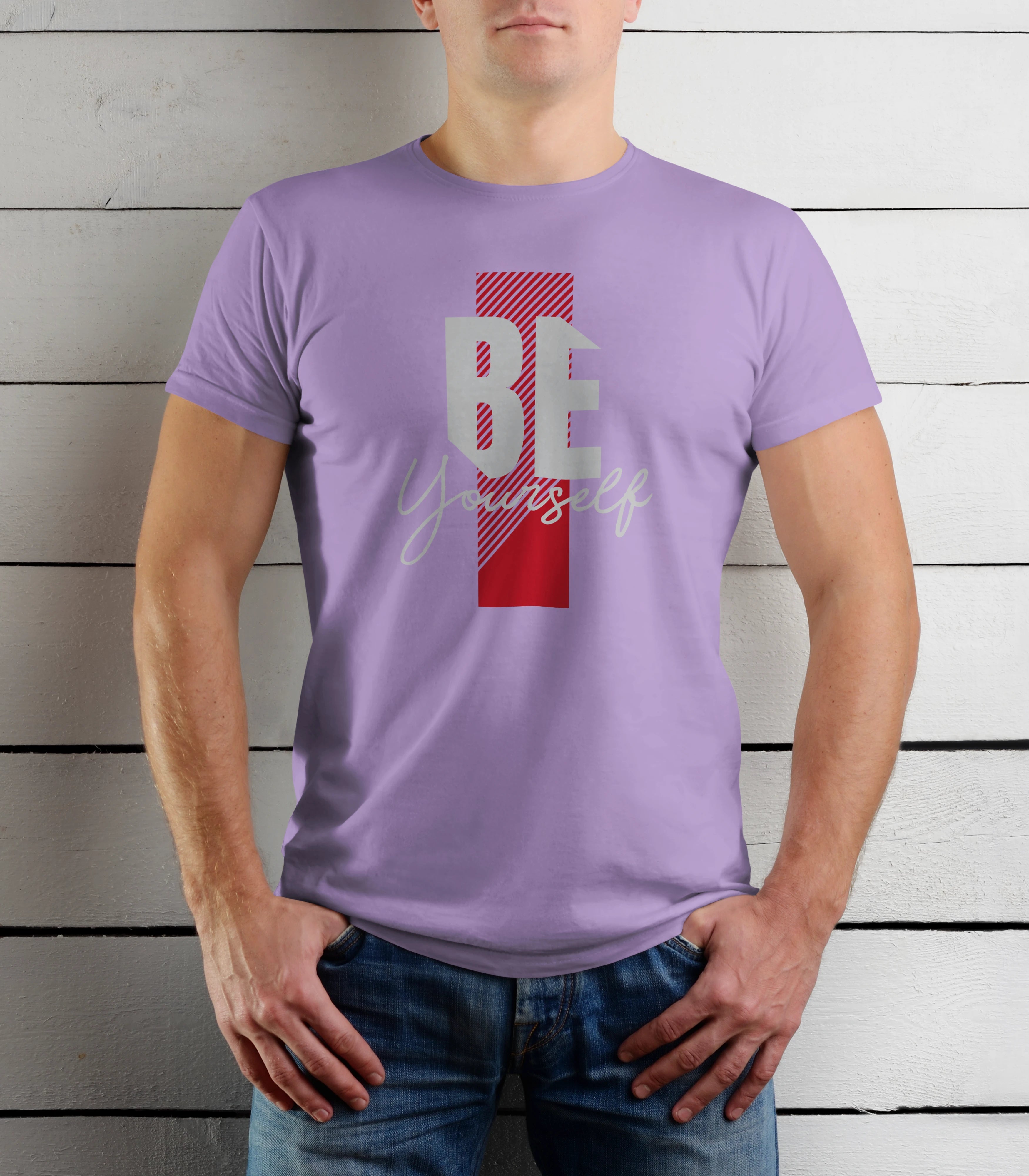 Person wearing a purple t-shirt with a motivational quote on a wooden background