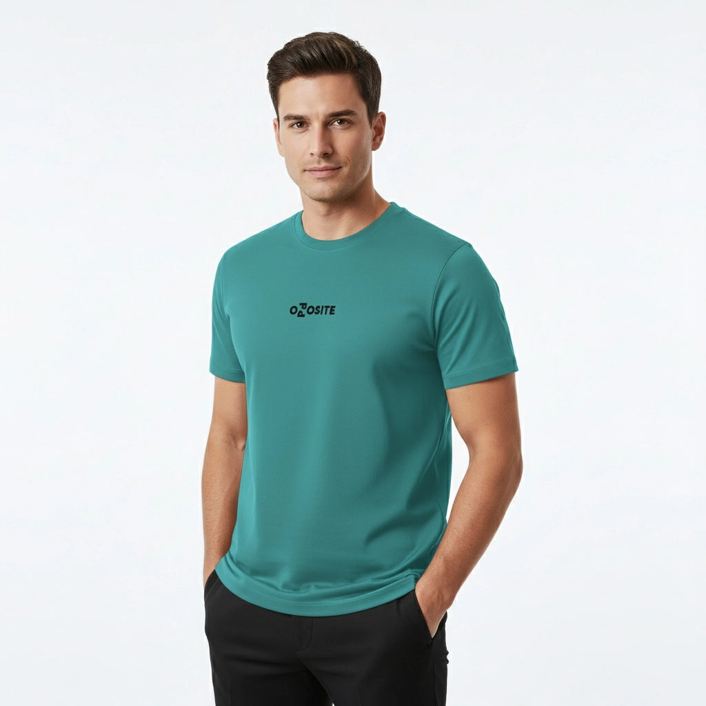 Man wearing a teal t-shirt with a logo on a white background