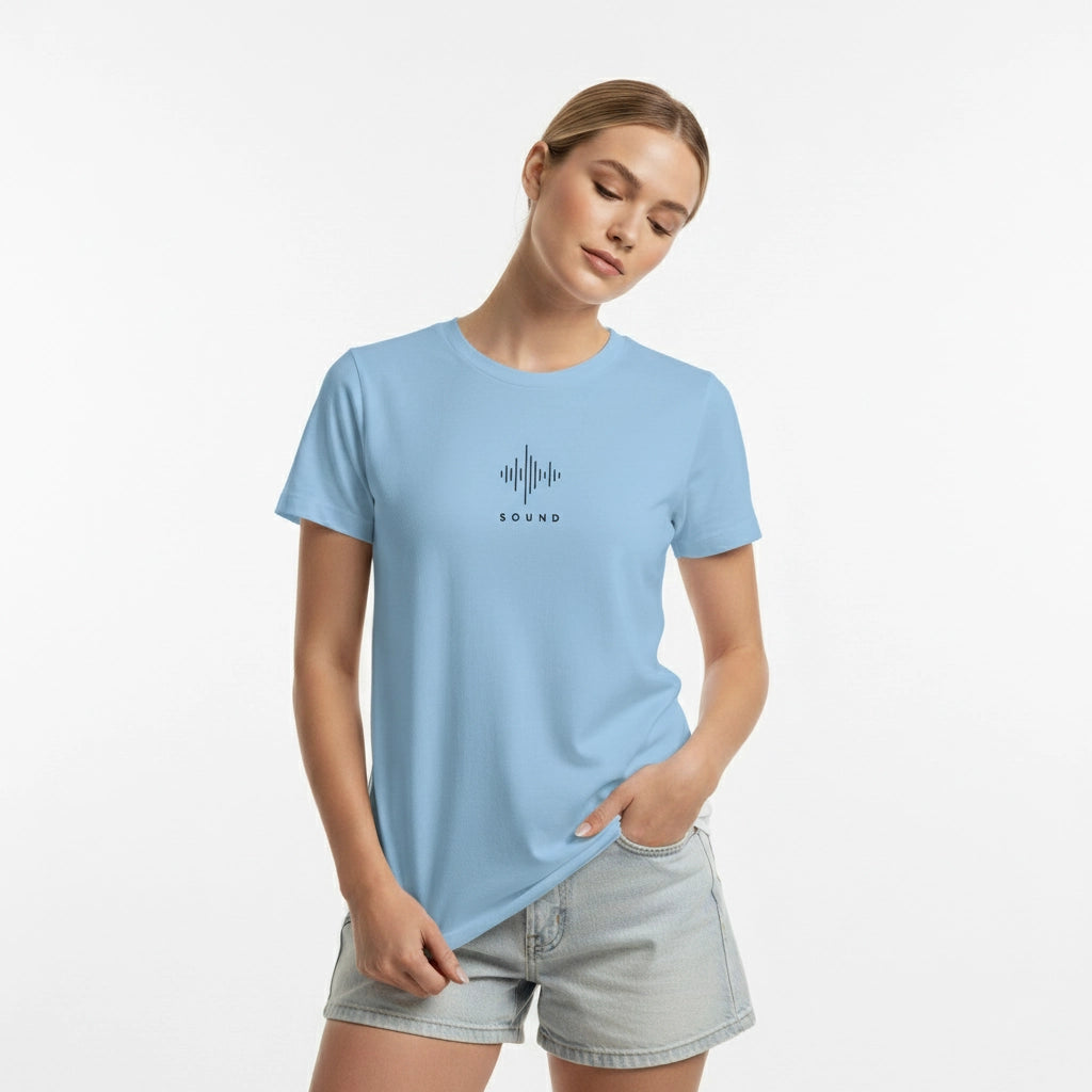Woman wearing a light blue t-shirt with a logo on a white background