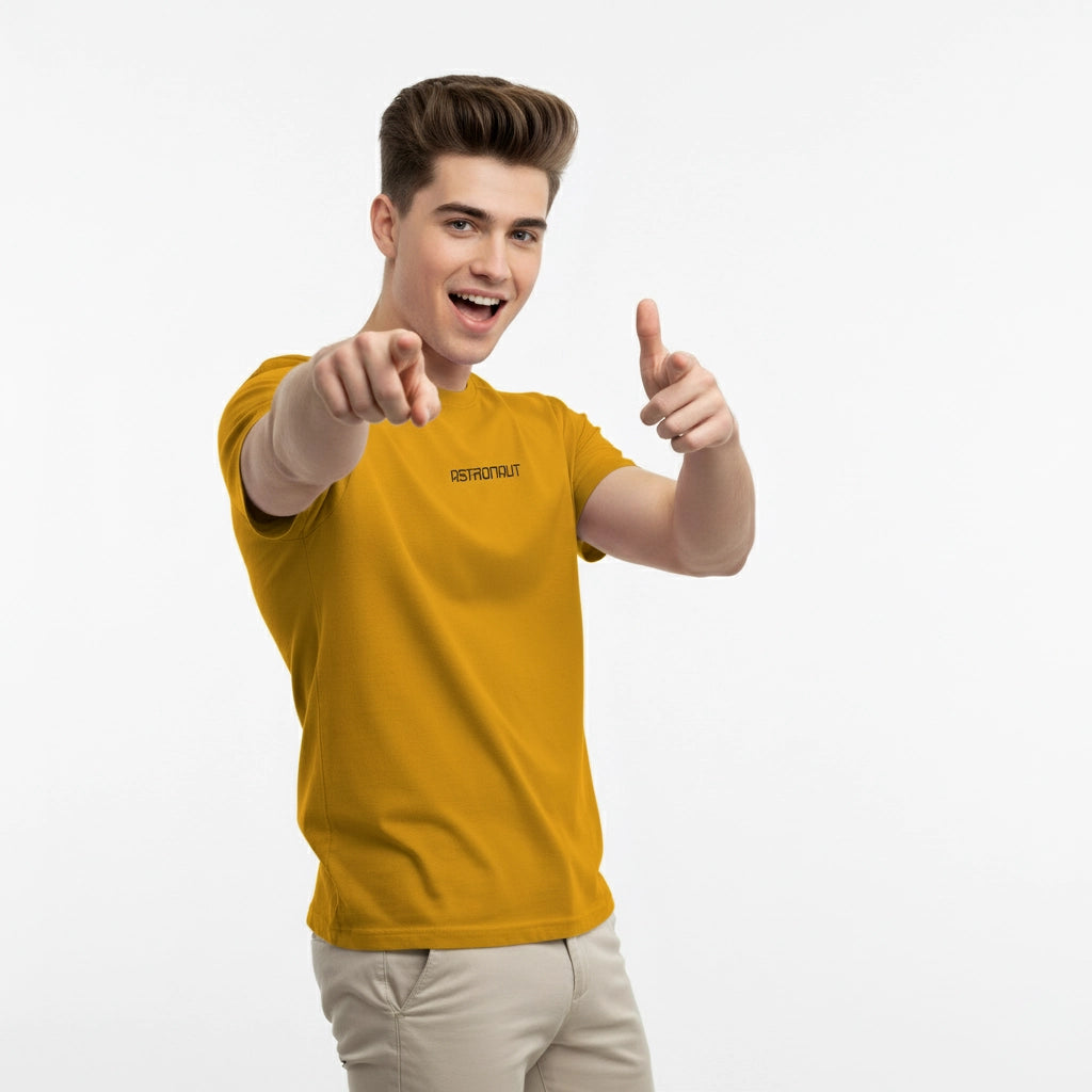 Person wearing a yellow t-shirt with a brand logo, pointing forward on a white background