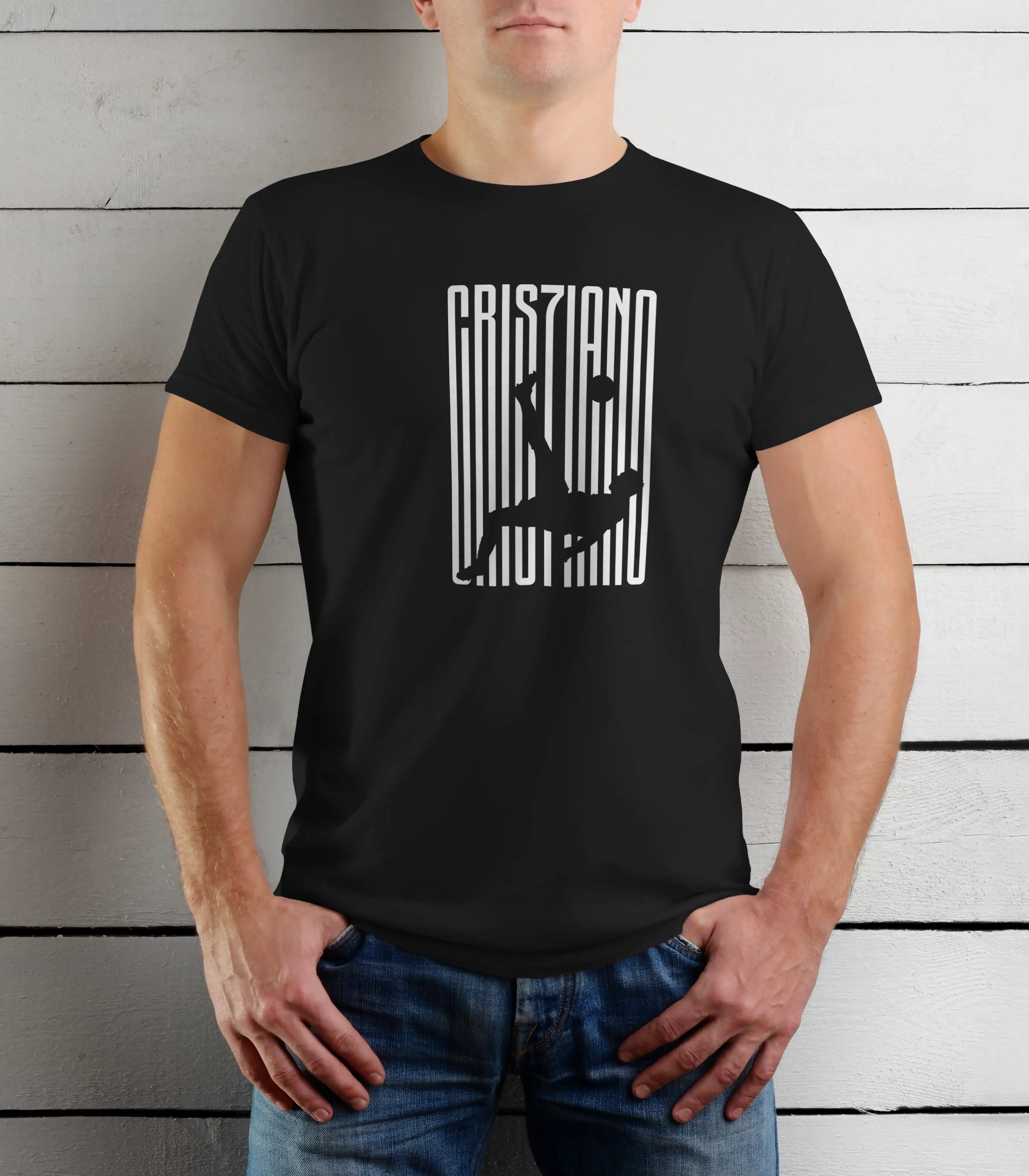 Person wearing a black t-shirt with white graphic design against a wooden background