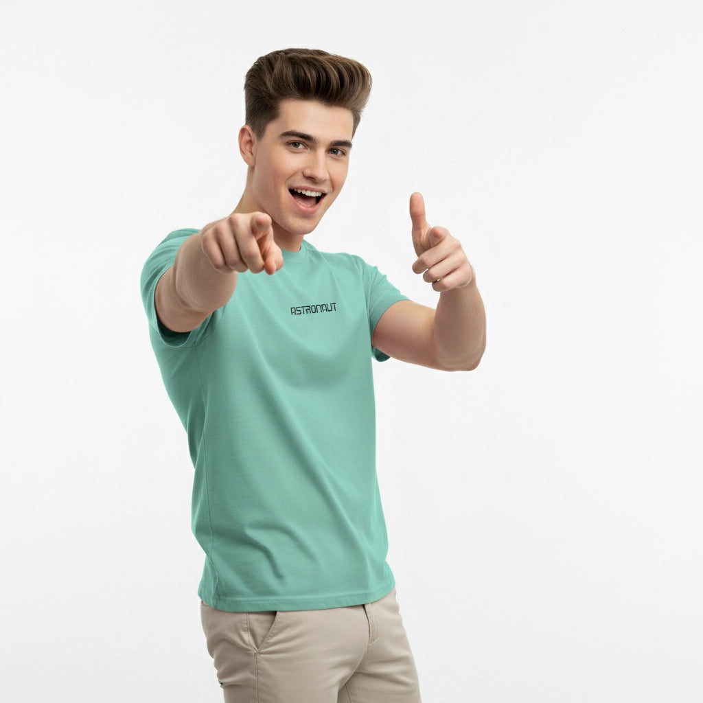 Person wearing a light blue t-shirt with a brand logo, giving a thumbs-up gesture on a white background