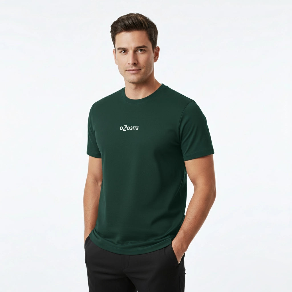 Man wearing a green t-shirt with a logo on a white background