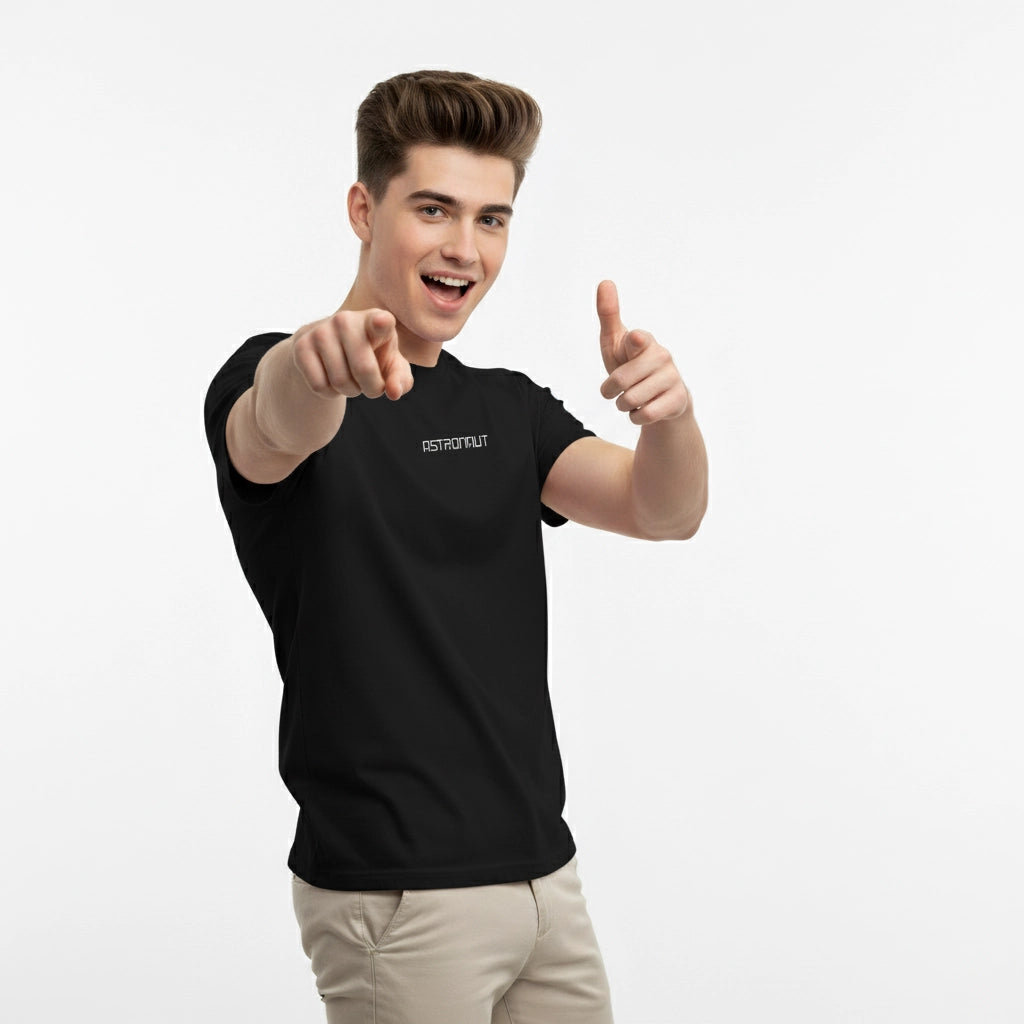 Person wearing a black t-shirt with a logo, pointing forward on a white background