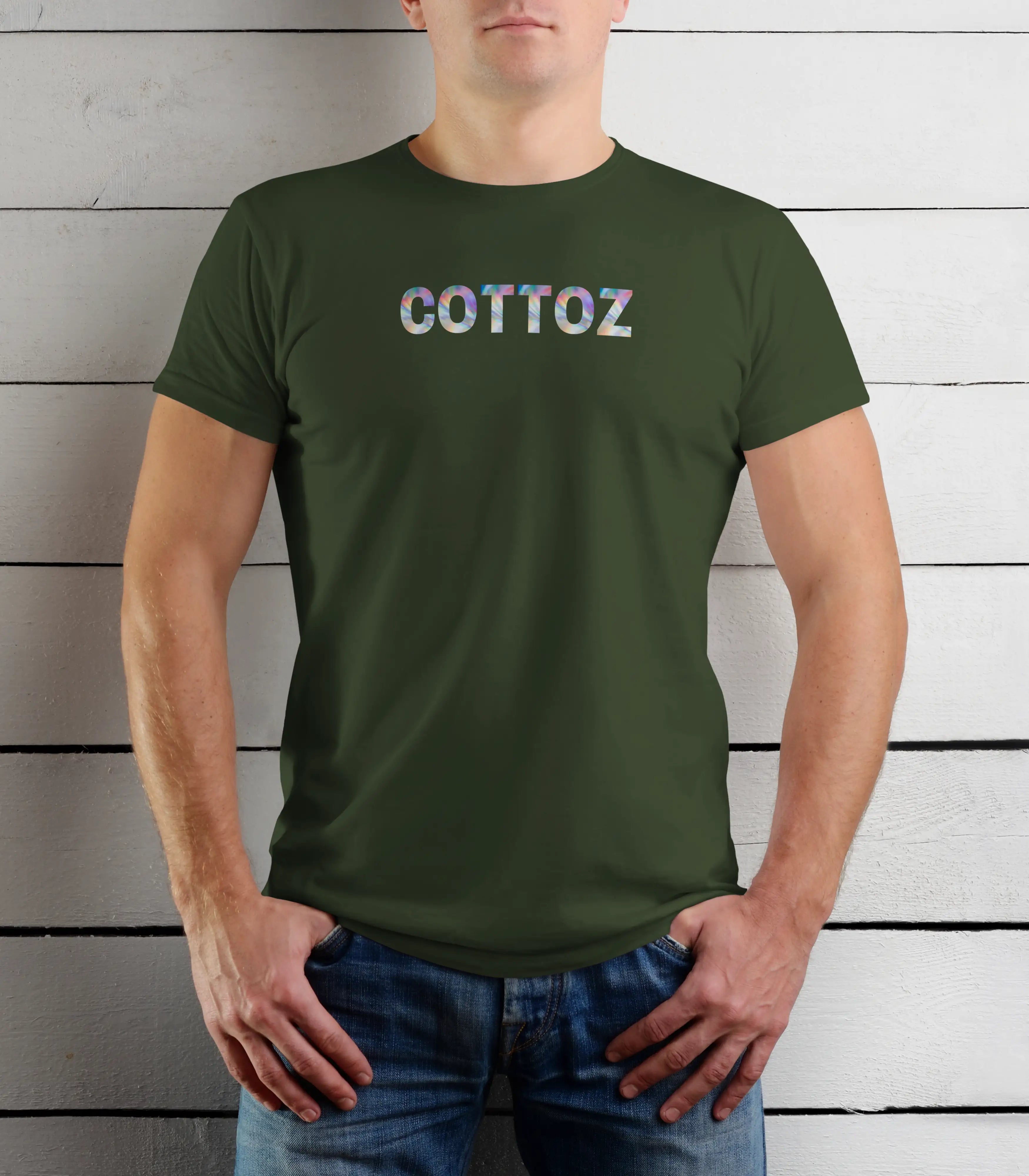 Person wearing a green t-shirt with 'COTTOZ' printed on it against a wooden background