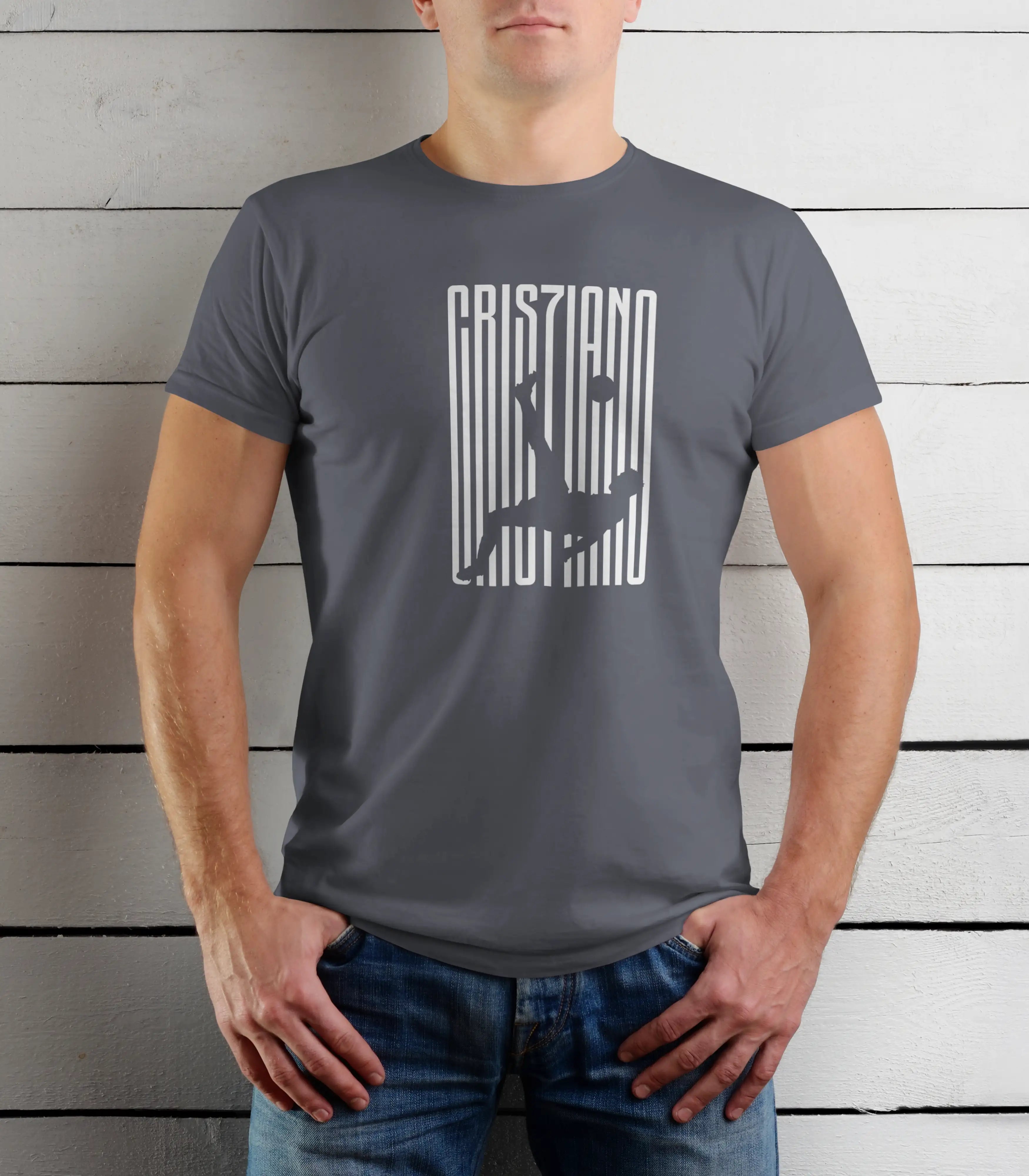 Person wearing a gray t-shirt with a graphic design against a wooden background