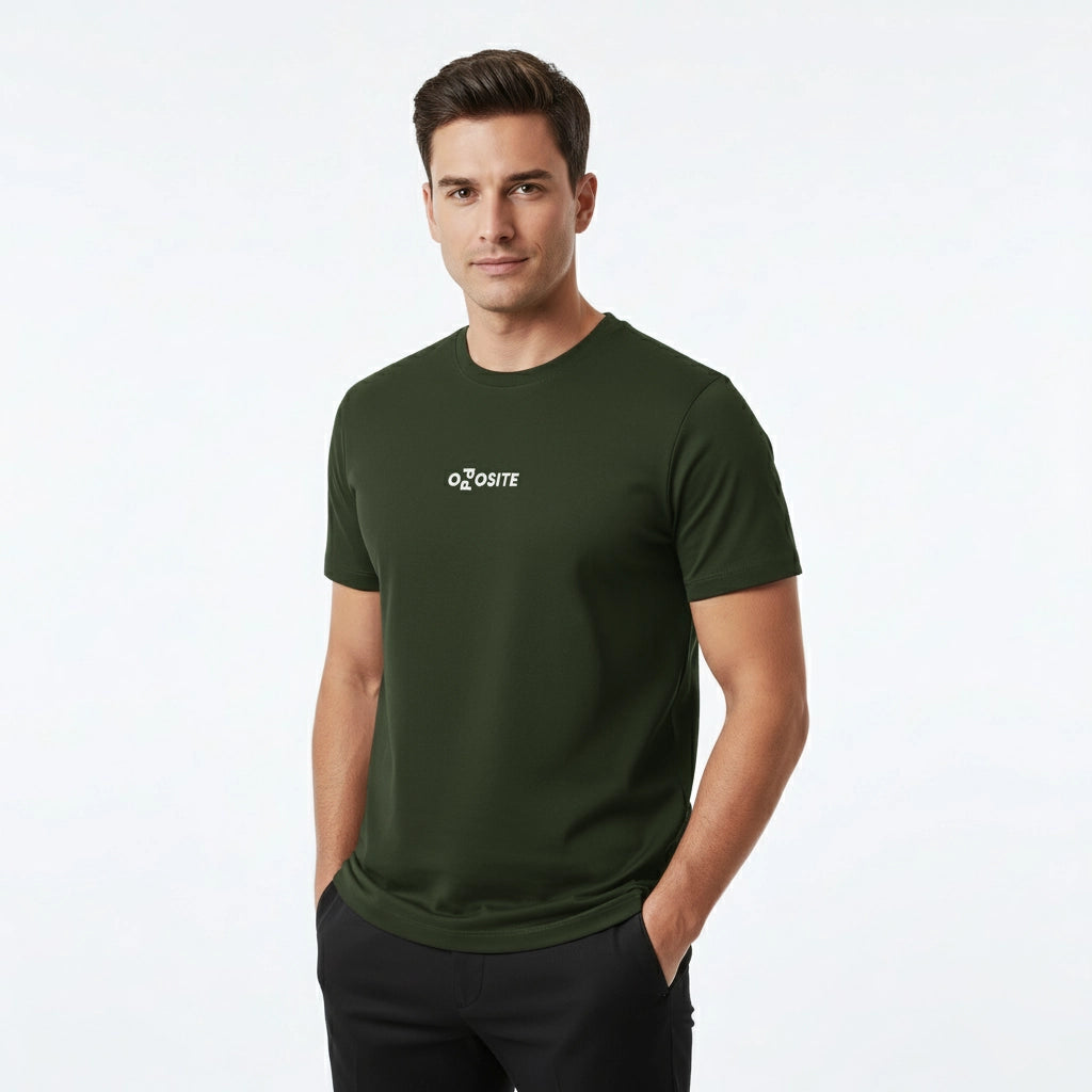Man wearing a green t-shirt with a logo on a white background