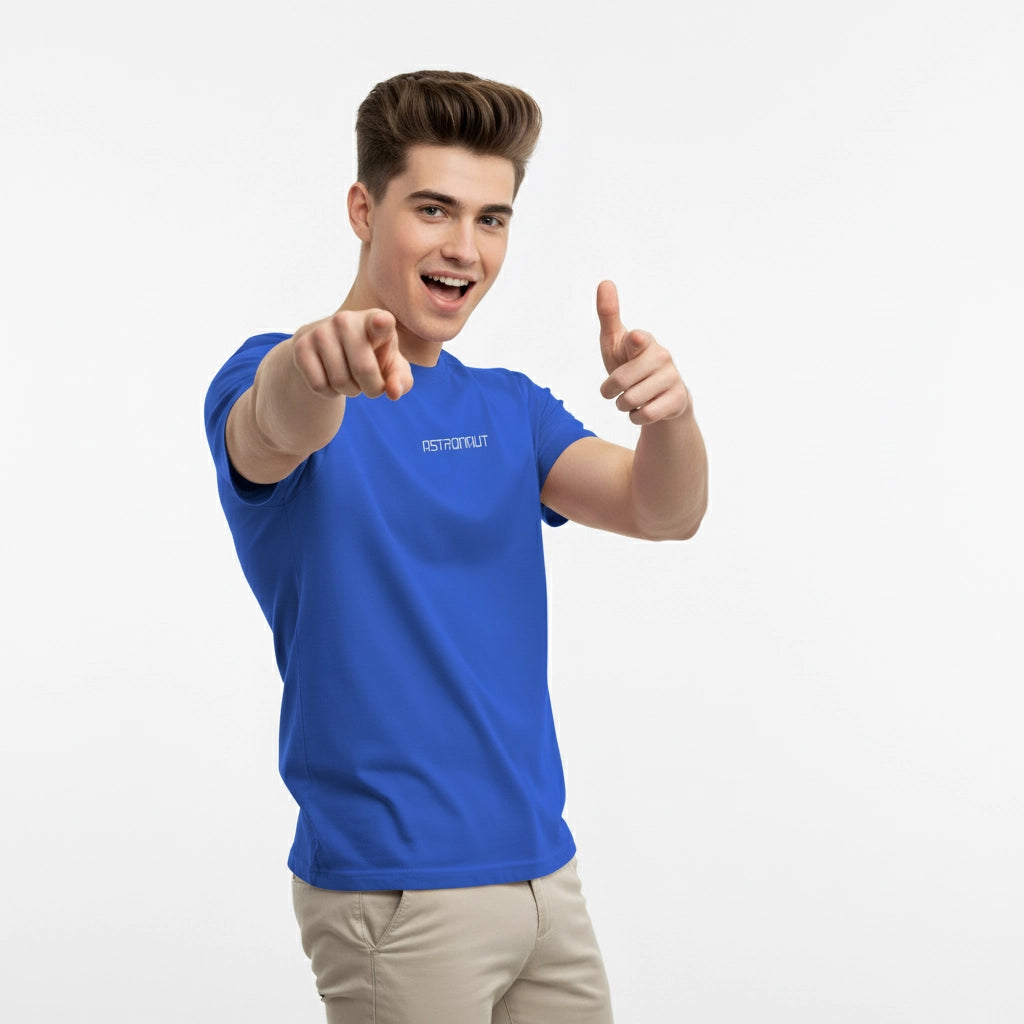 Man wearing a blue t-shirt with a brand logo, pointing forward on a white background