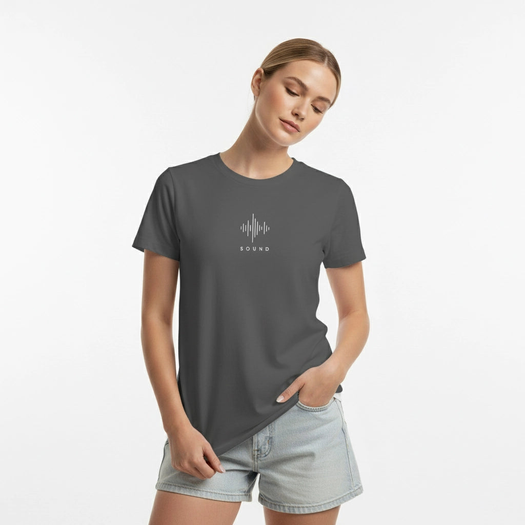 Woman wearing a gray t-shirt with a white graphic design on a light gray background