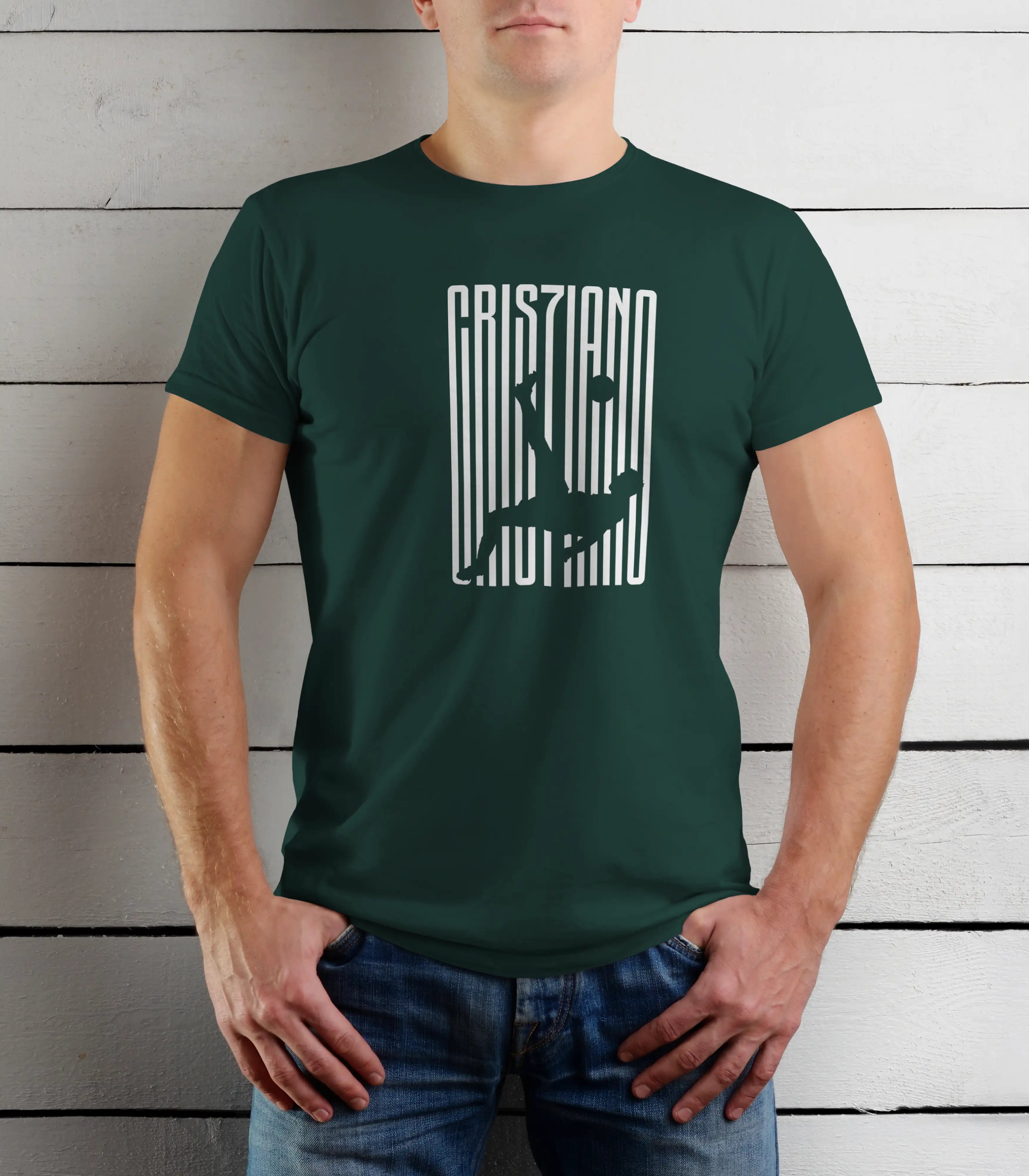 Person wearing a green t-shirt with white text against a wooden background