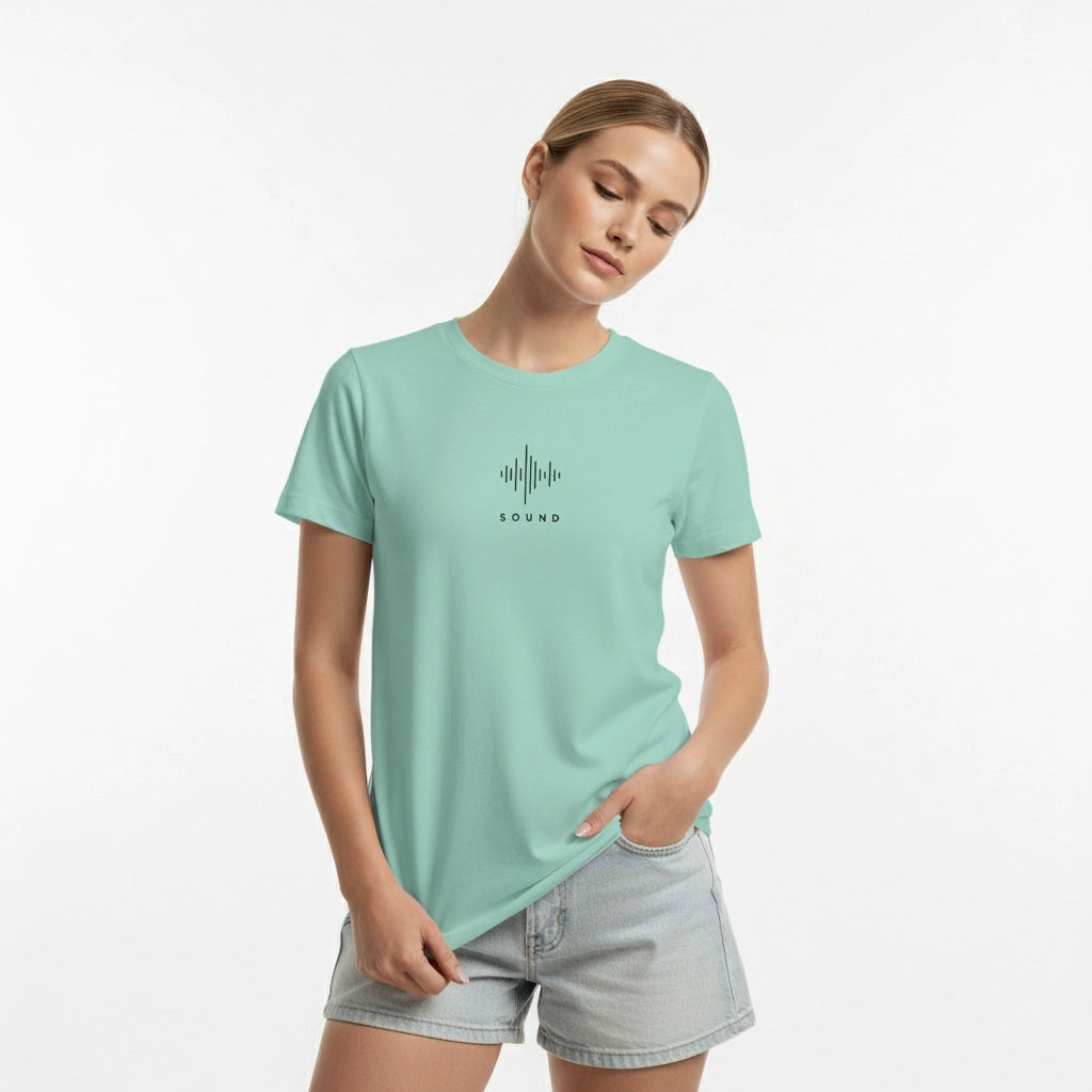 Woman wearing a light green t-shirt with a logo on a white background