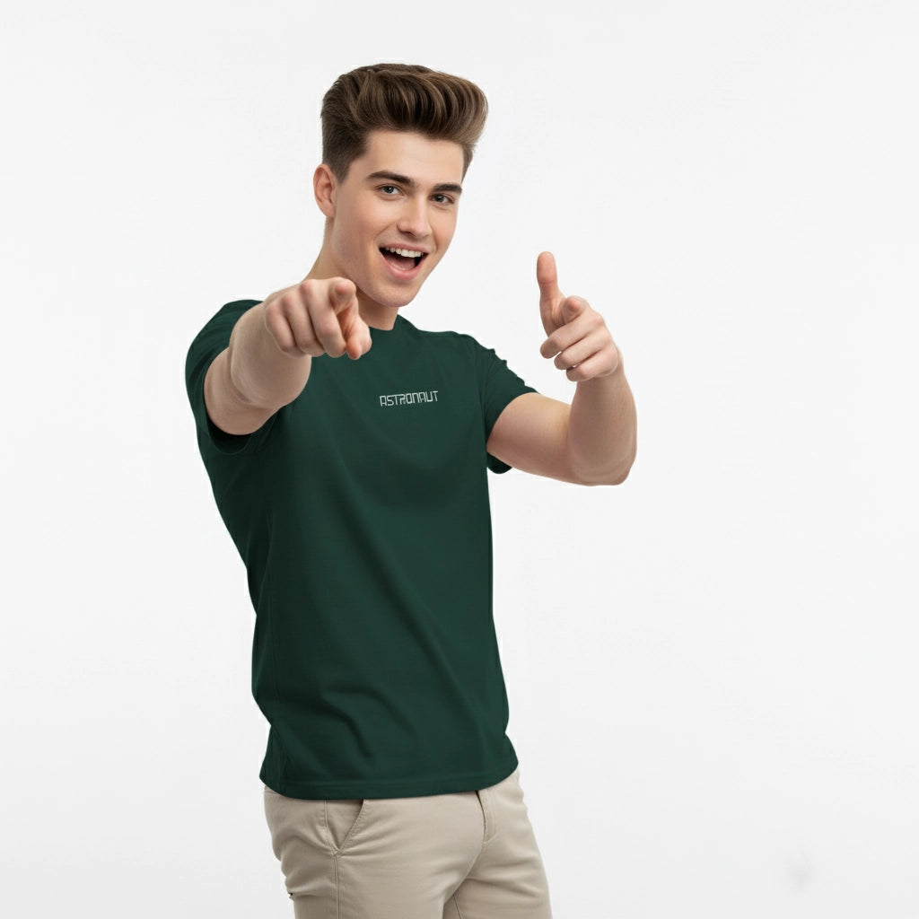 Person wearing a green t-shirt with a brand logo, giving a thumbs-up gesture on a white background