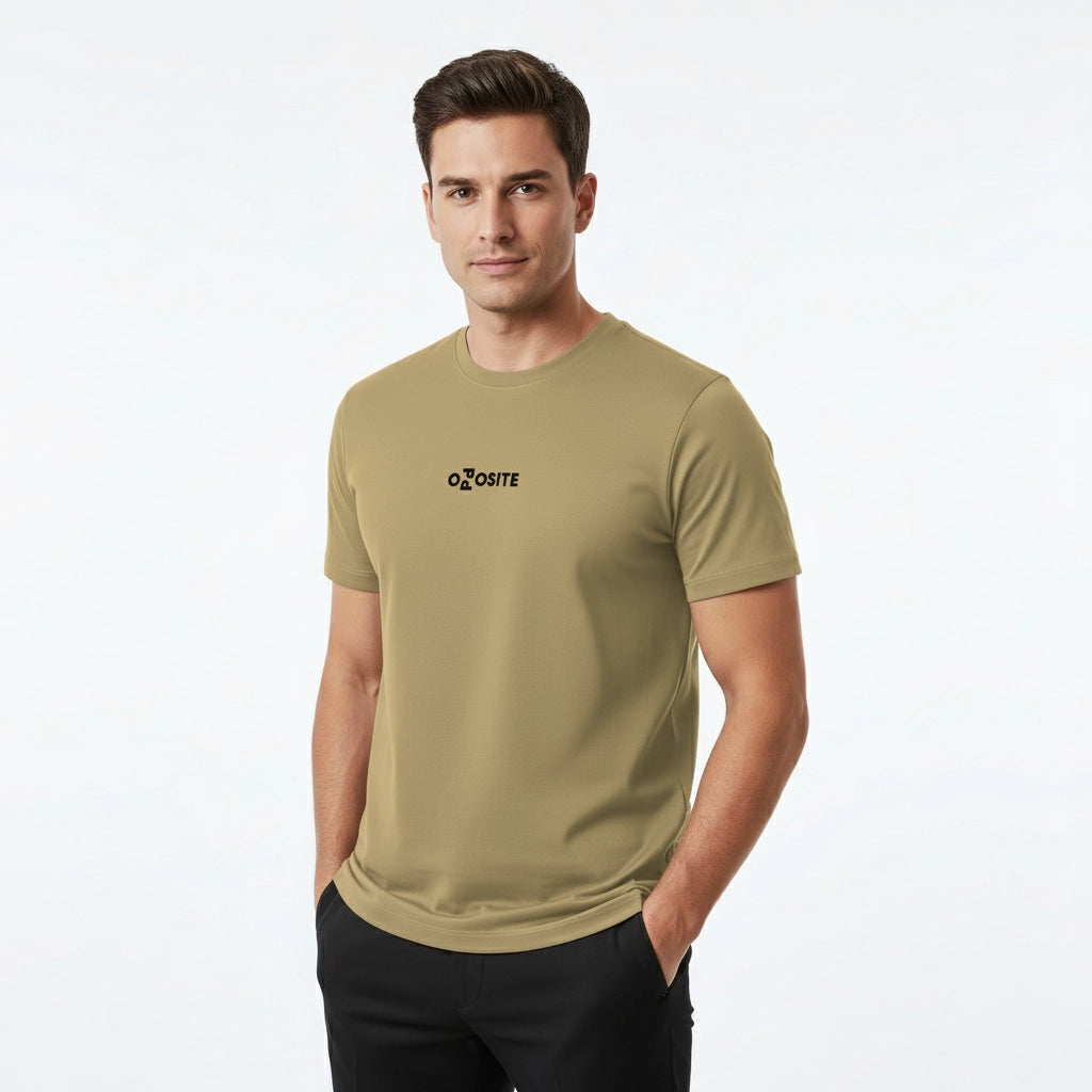 Man wearing a beige t-shirt with a logo on a white background