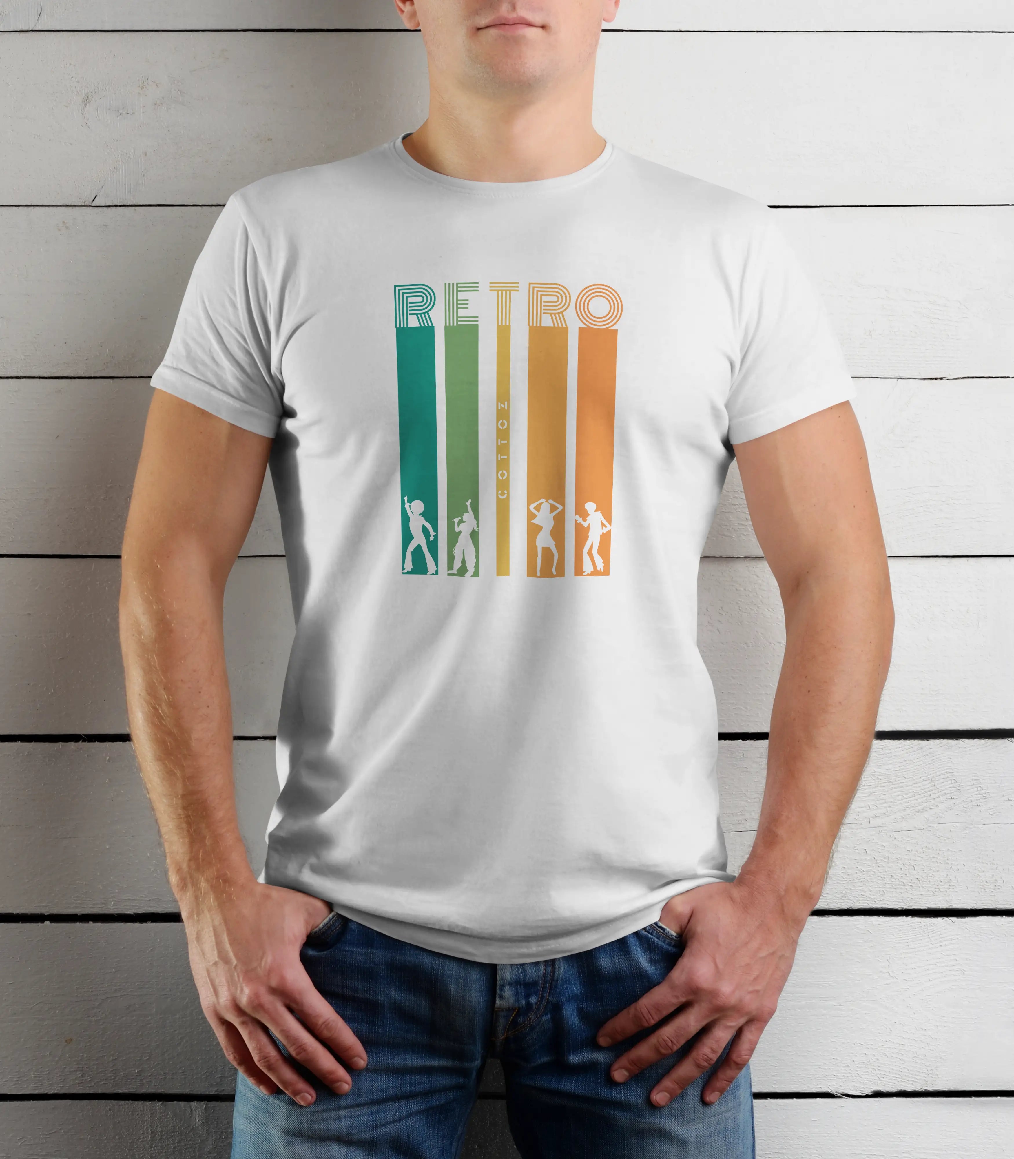 Person wearing a white t-shirt with a retro design against a wooden background