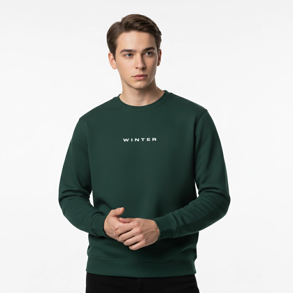 Man wearing a green sweatshirt with 'WINTER' text on a white background