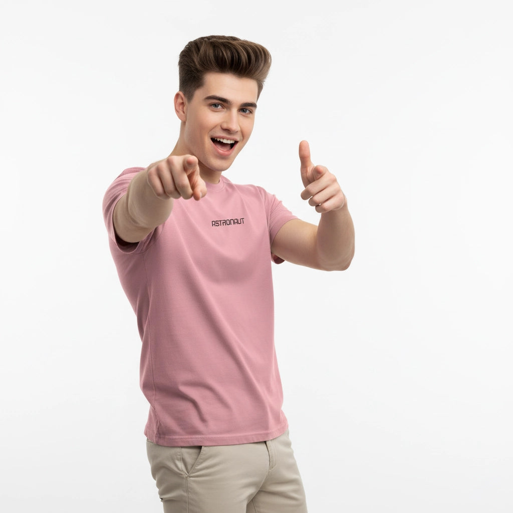 Person wearing a pink t-shirt with a brand logo, pointing forward on a white background