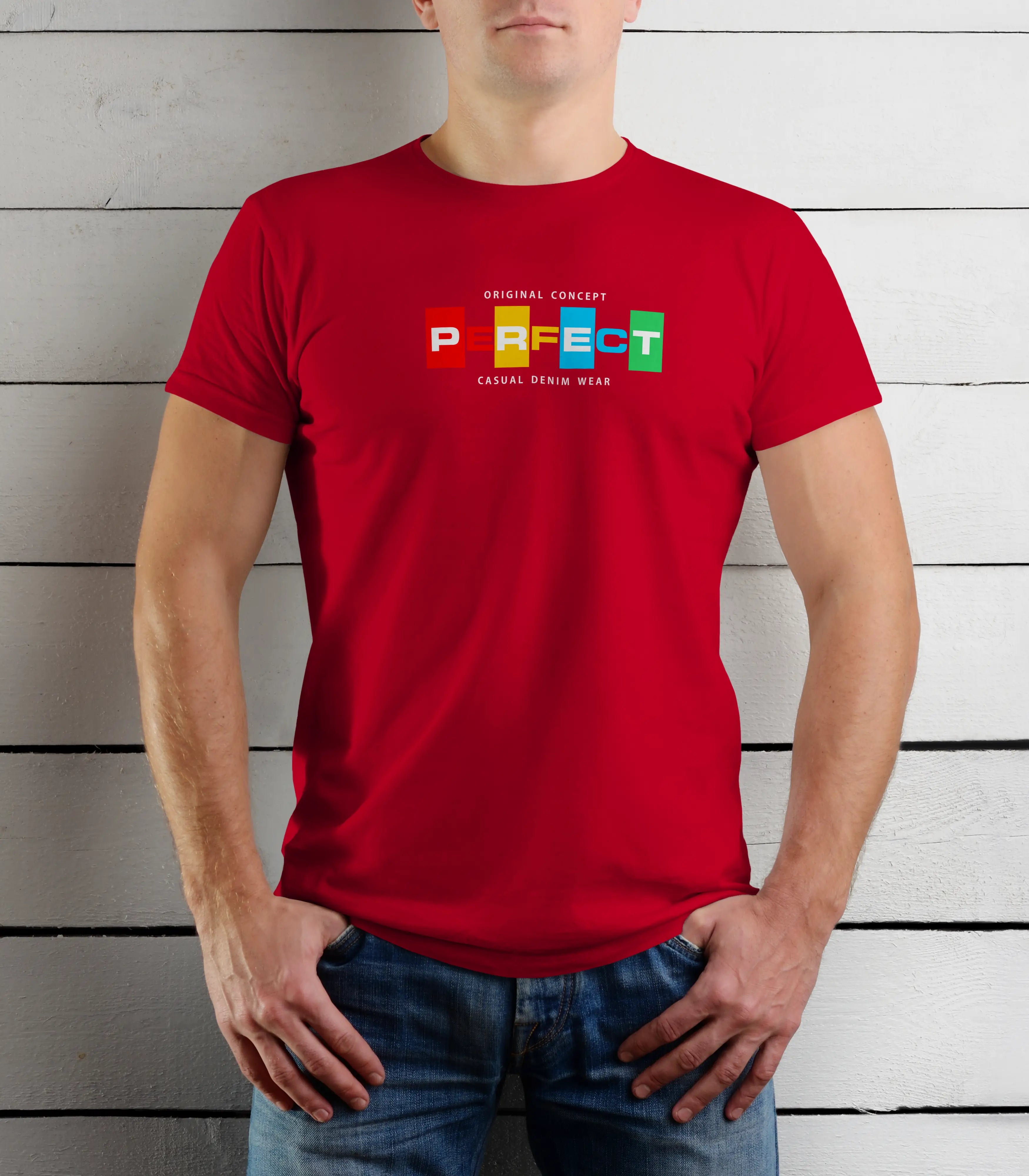 Person wearing a red t-shirt with colorful text design against a wooden background