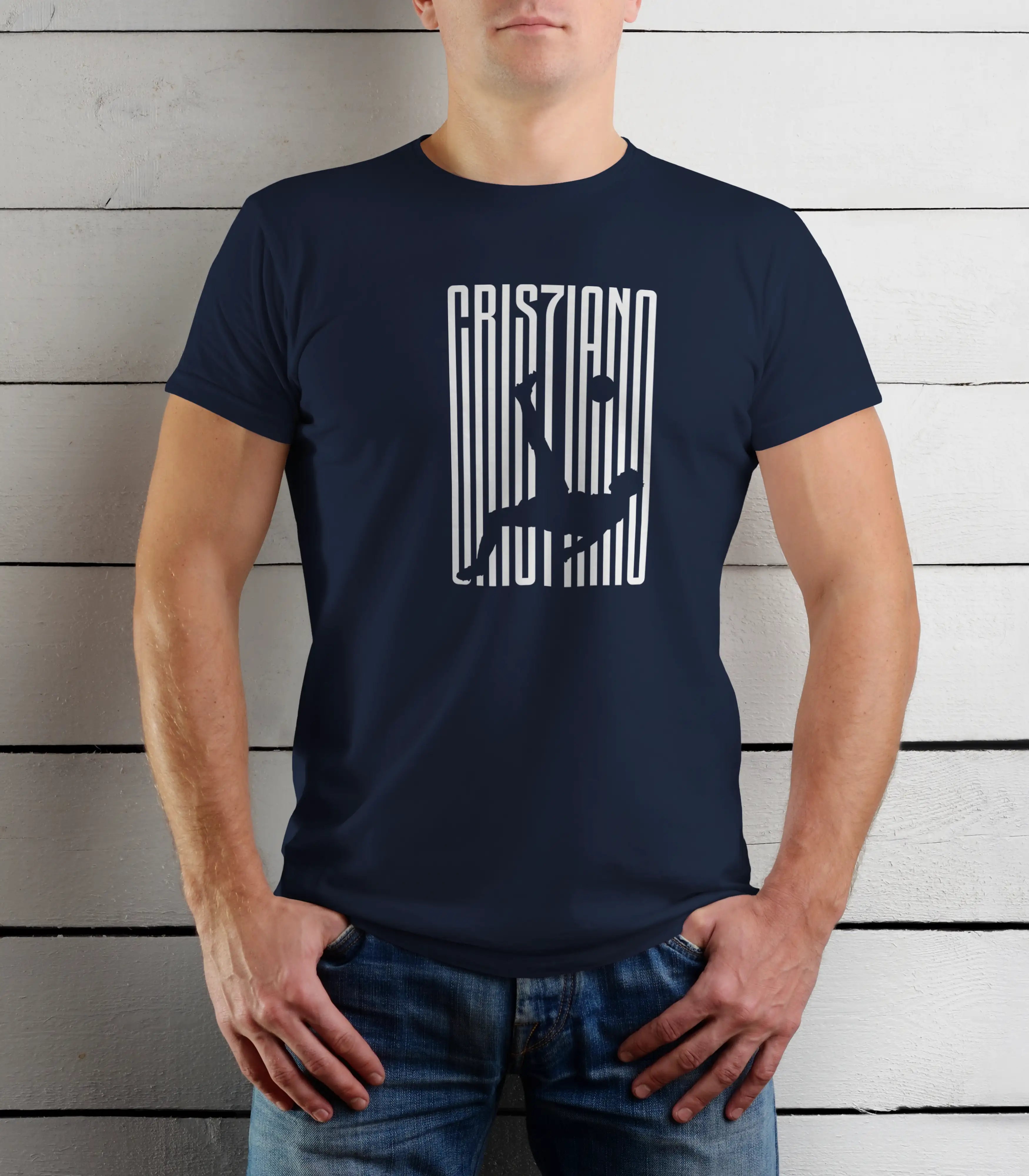 Person wearing a navy blue t-shirt with white graphic design against a wooden background