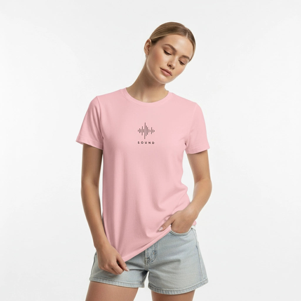 Woman wearing a pink t-shirt with a graphic design on a white background