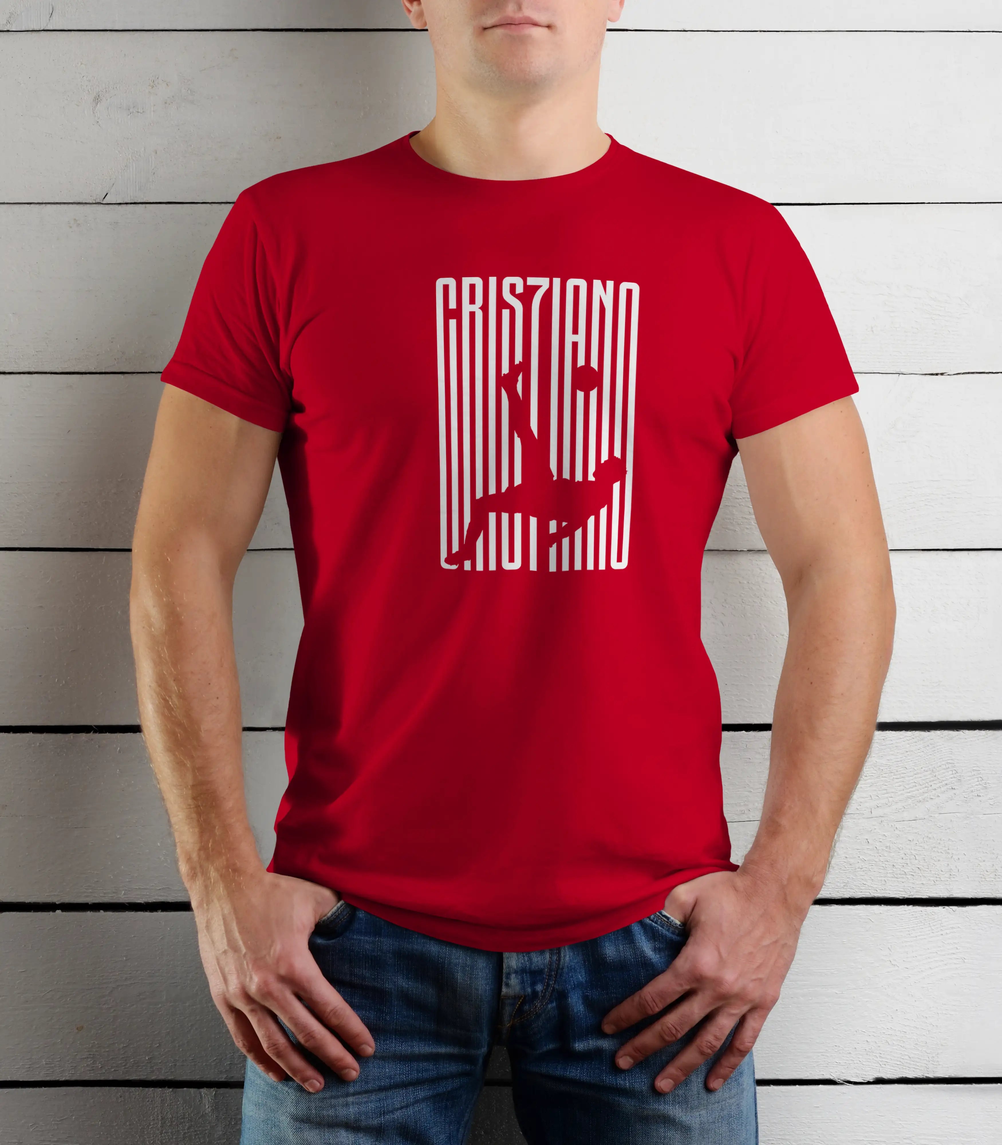 Person wearing a red t-shirt with white text against a wooden background