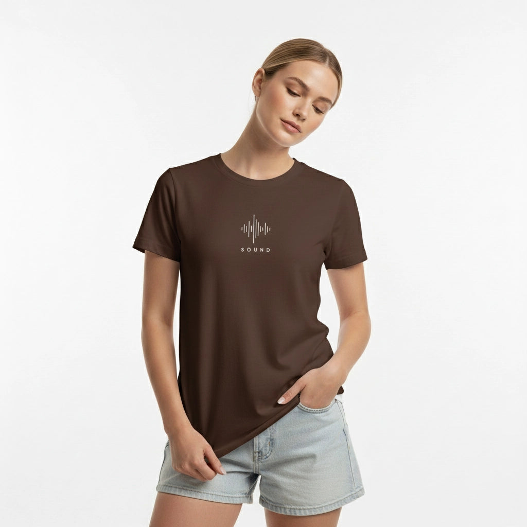 Woman wearing a brown t-shirt with a graphic design on a white background