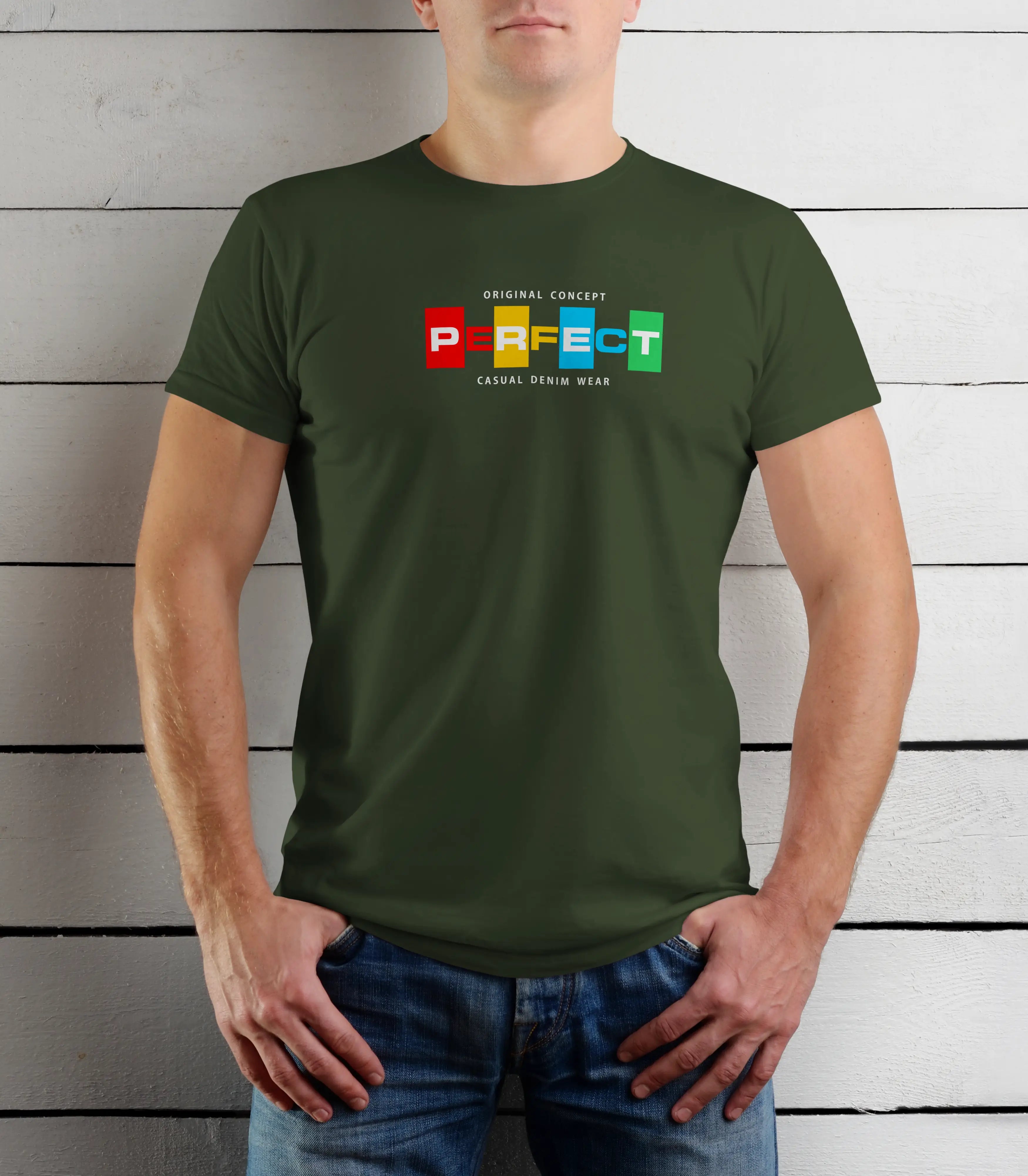 Person wearing a green t-shirt with colorful text design against a wooden background
