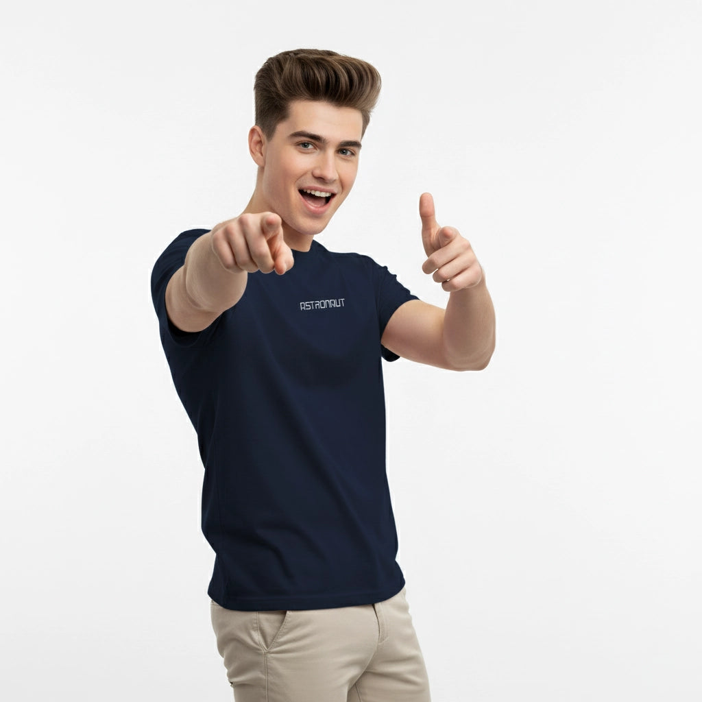 Man wearing a navy blue t-shirt with text, giving a thumbs-up gesture on a white background