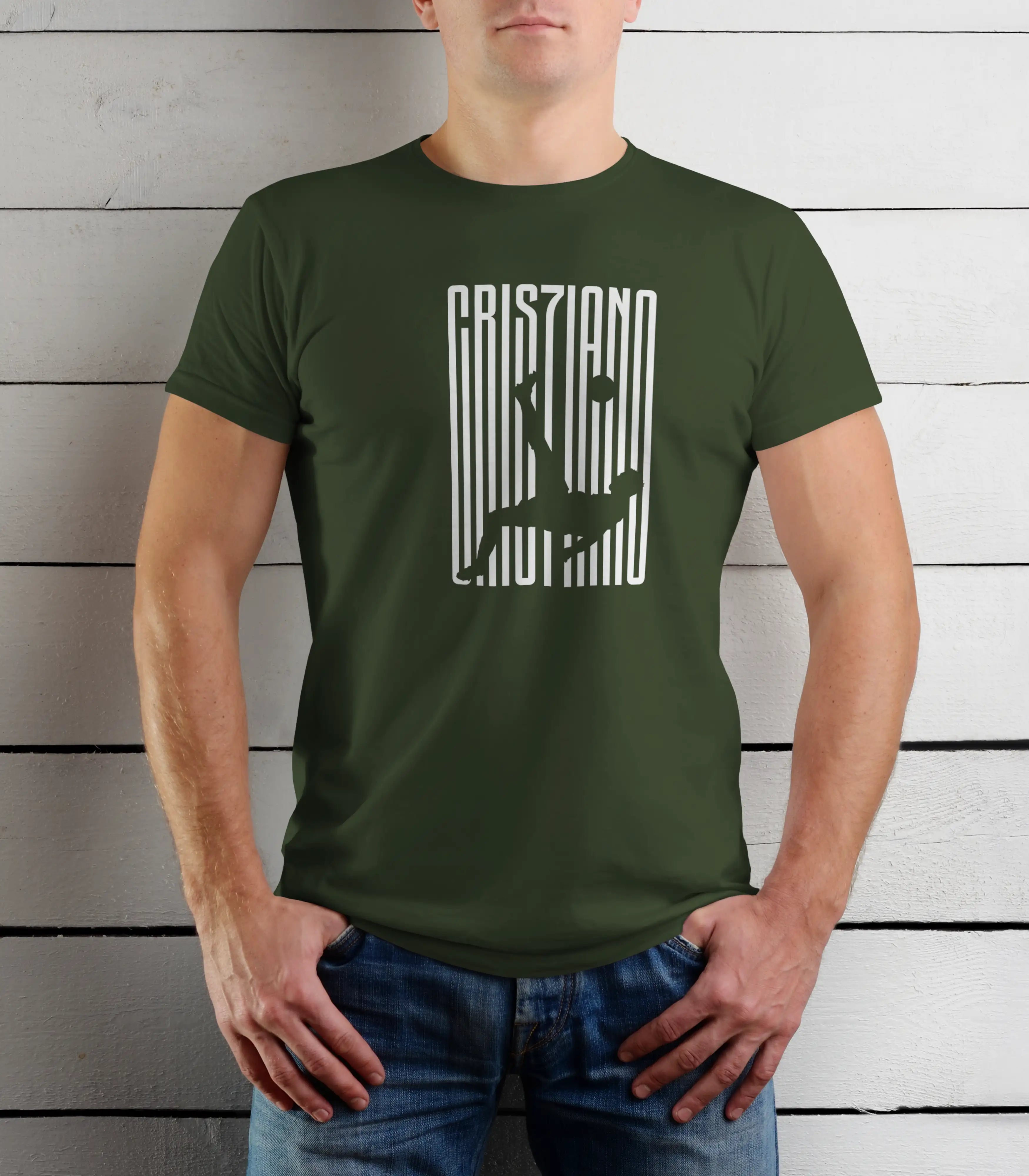 Person wearing a green t-shirt with a graphic design on a wooden background