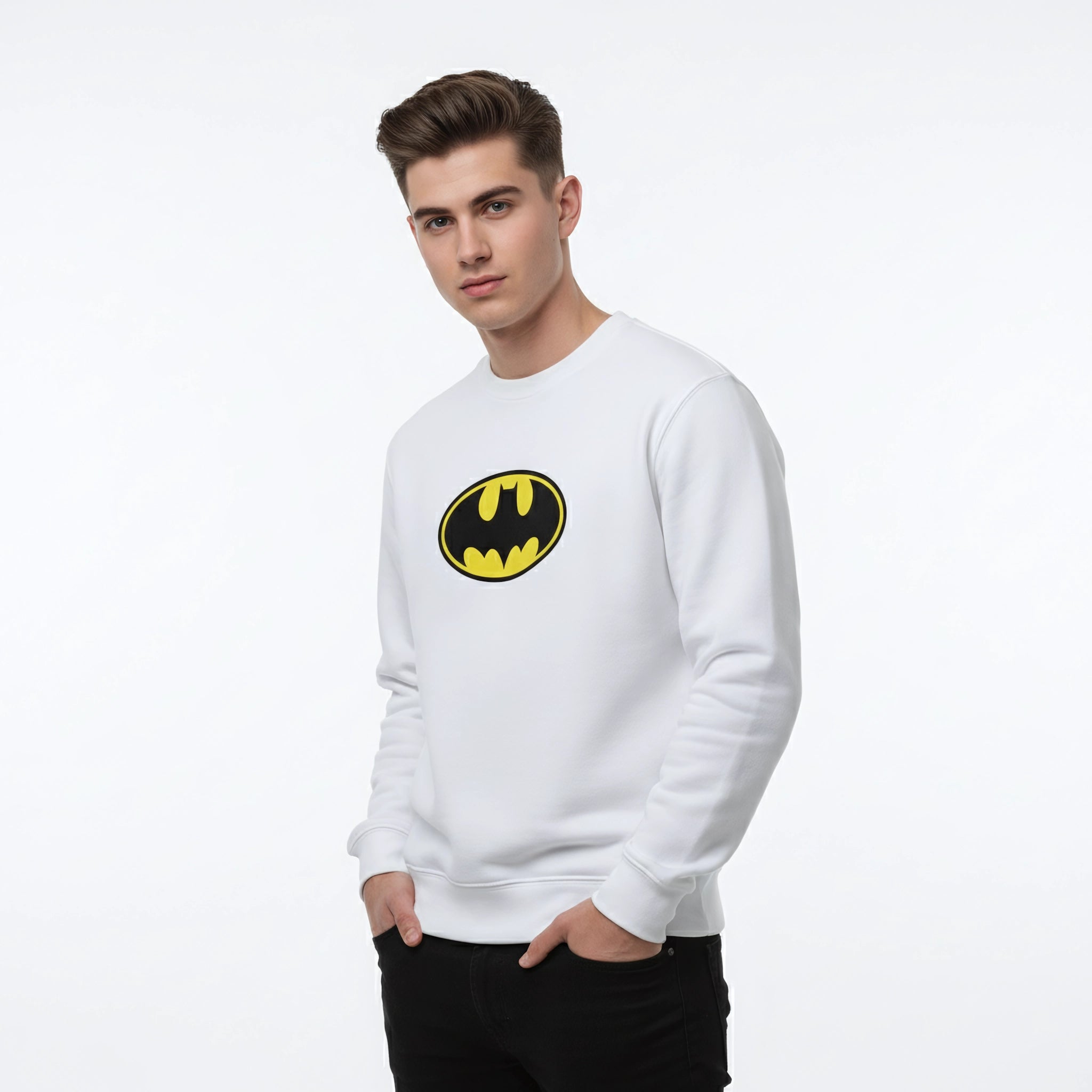 Man wearing a white sweatshirt with a Batman logo on a light gray background